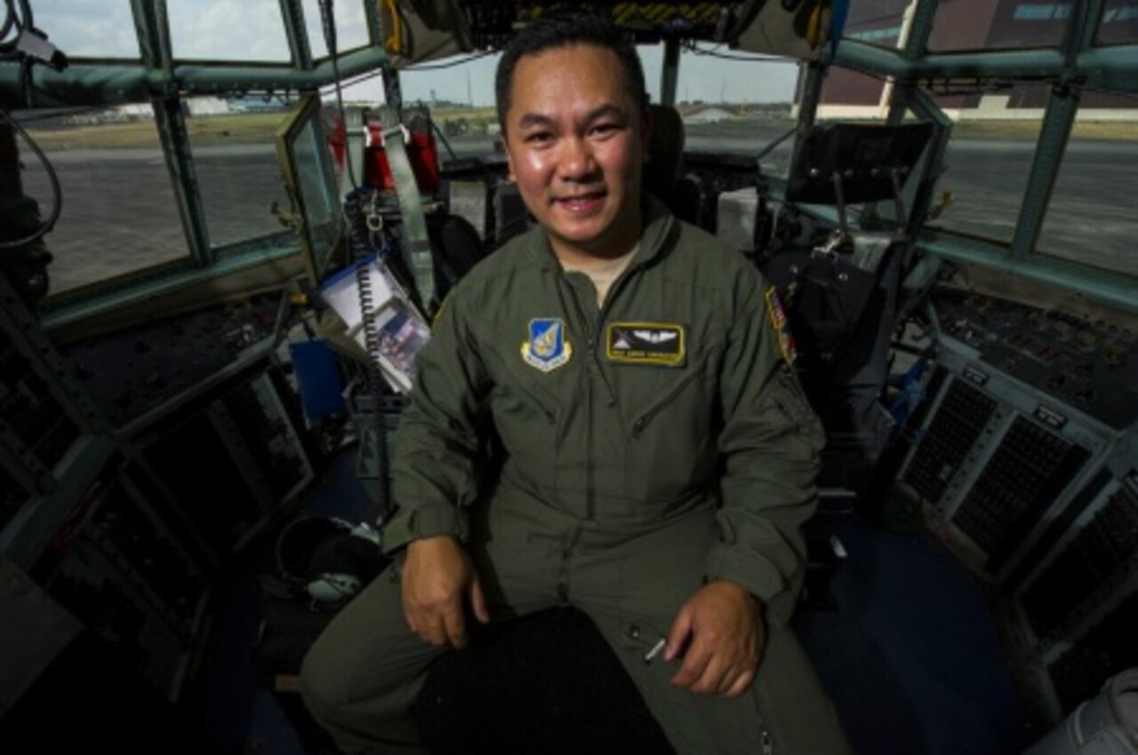 Air Force Staff Sgt. Andre Garrucho, a C-130 Hercules aircraft flight engineer with the 36th Airlift Squadron, Yokota Air Base, Japan, sits in the flight deck of a C-130 at Clark Air Base, Philippines April 28, 2015. Garrucho was chosen to participate in Exercise Balikatan 2015 in part for his technical skill and in part because of his ability to speak fluently in both English and Tagalog, two of the most widespread languages in the Philippines. U.S. Air Force photo by Staff Sgt. Nathan Allen
