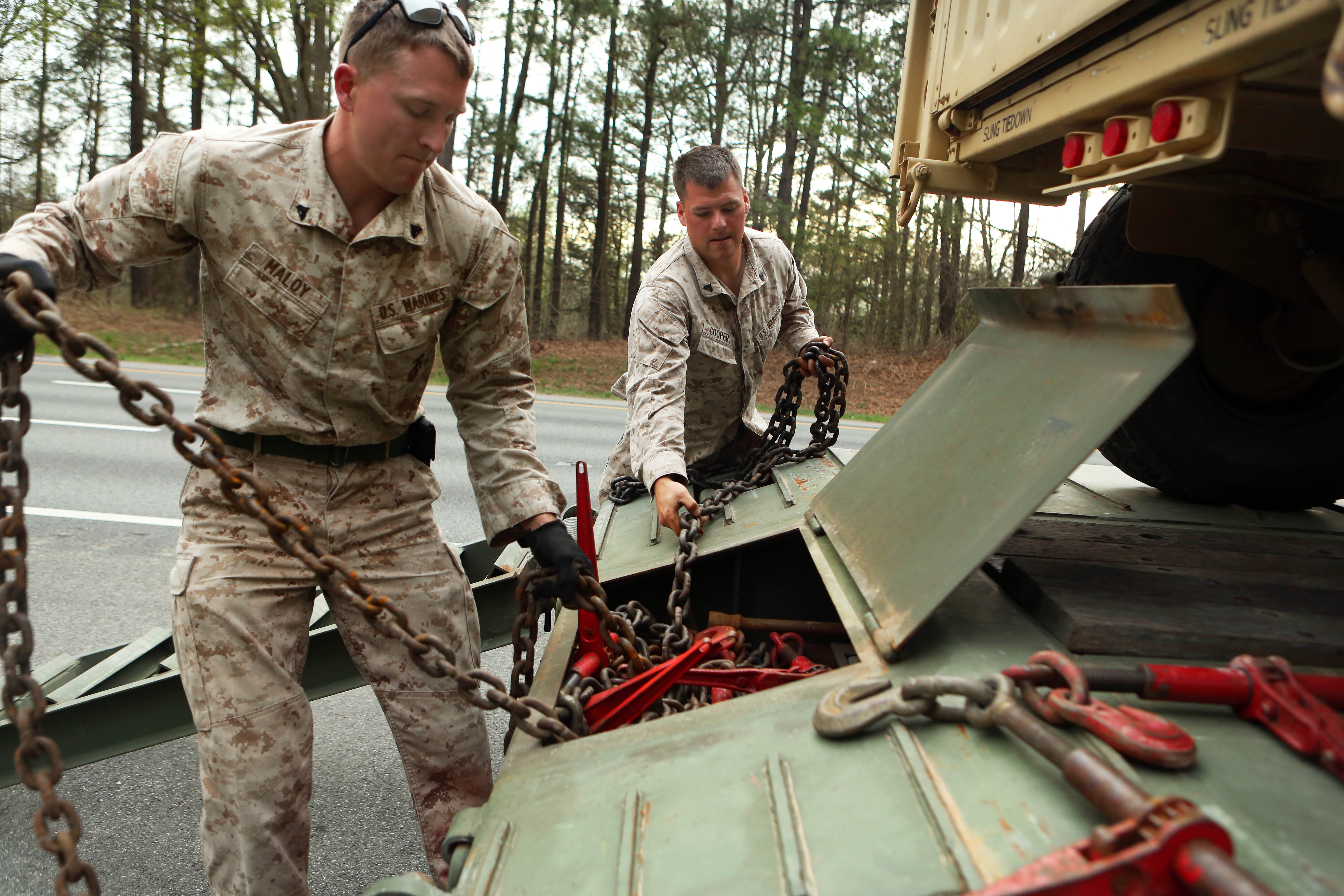 Marine Corps Cpls. Alex Maloy, left, and Michael Cooper prepare an ...