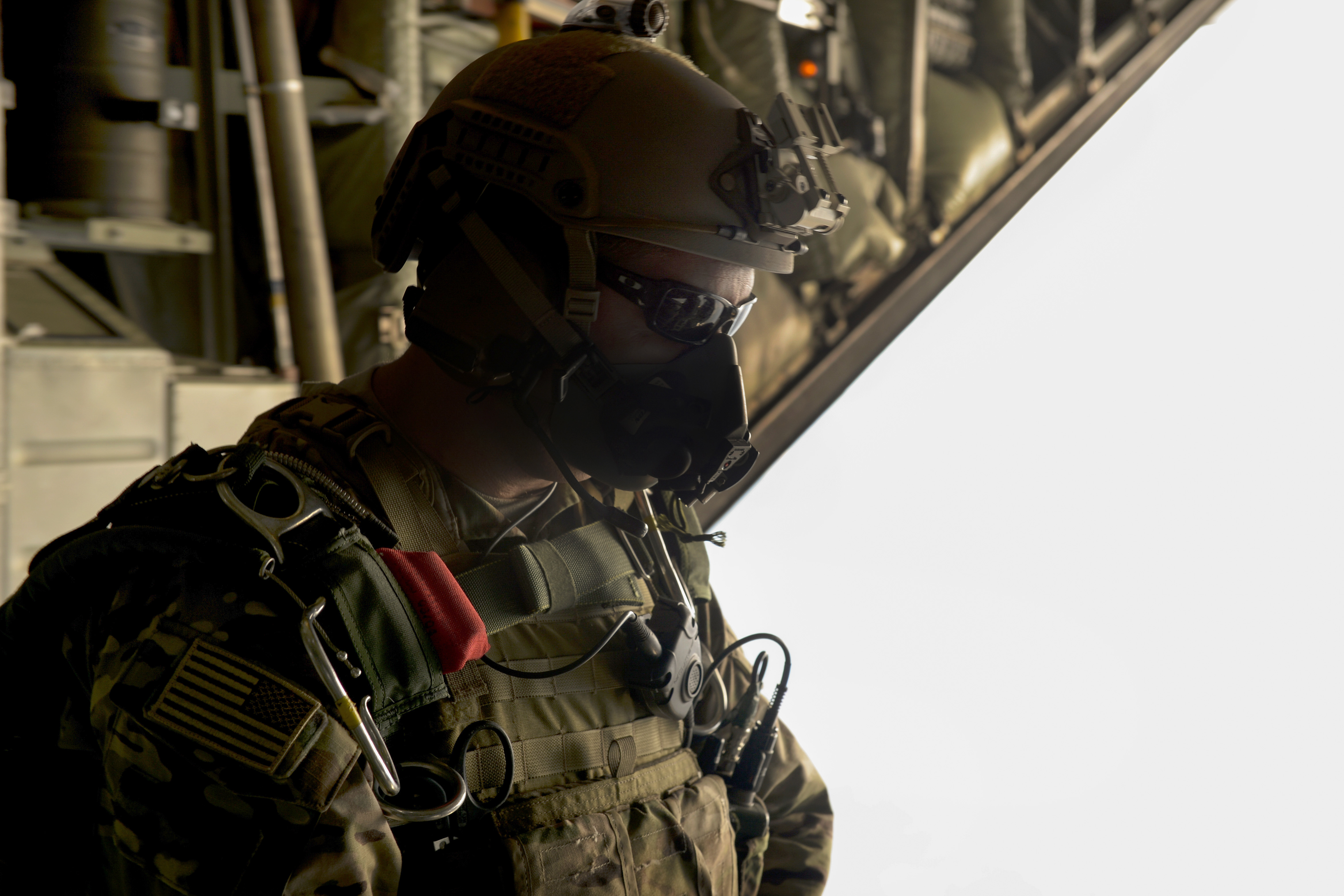 A U.S. Army Green Beret waits to jump out of a C-130H3 Hercules