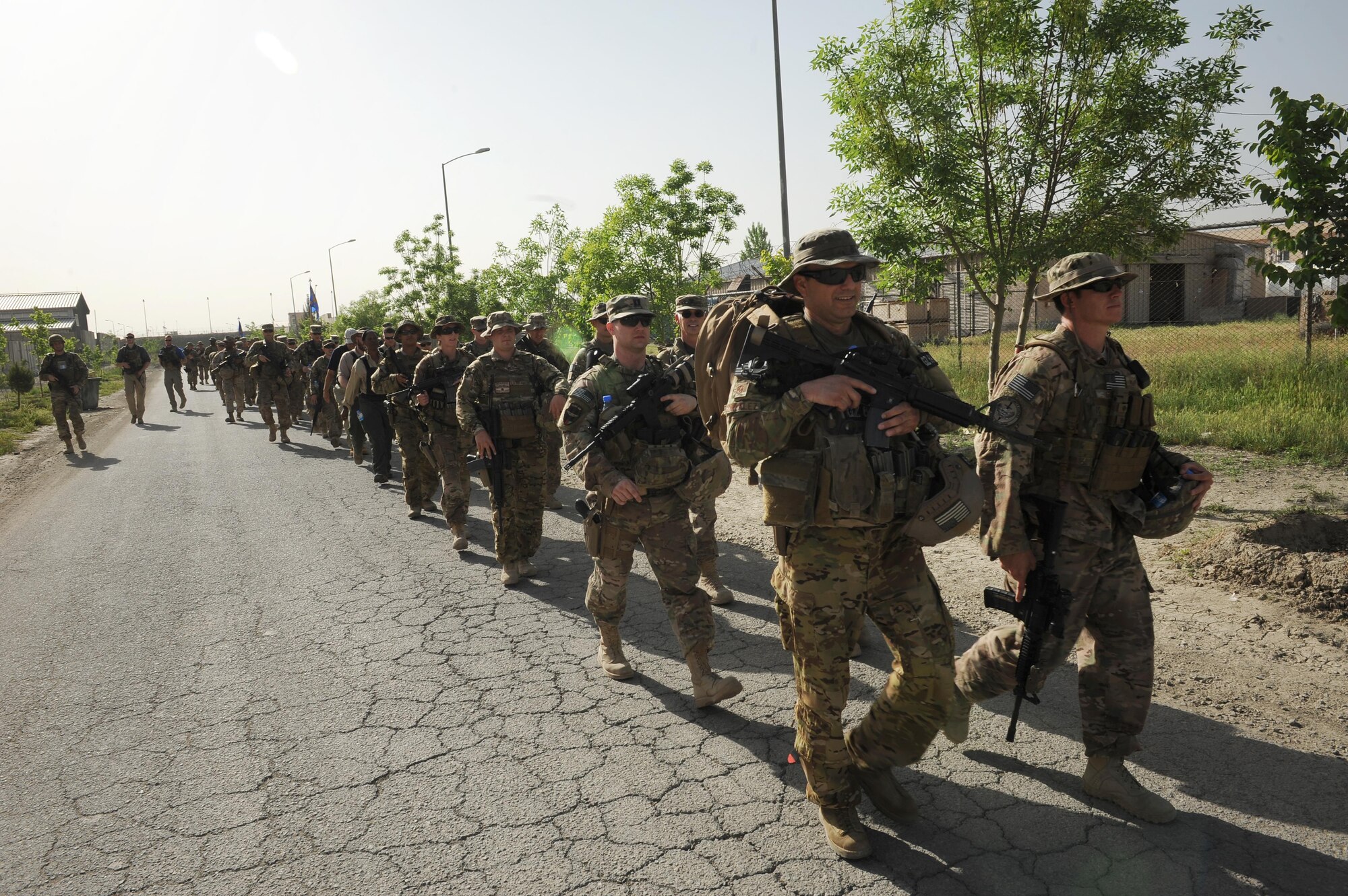 Train, Advise, Assist Command – Air U.S. and coalition service members and contractors walked nine kilometers, April 27, in honor of nine teammates who lost their lives four years ago. (Official U.S. Air Force photo/Capt. Jeff M. Nagan)