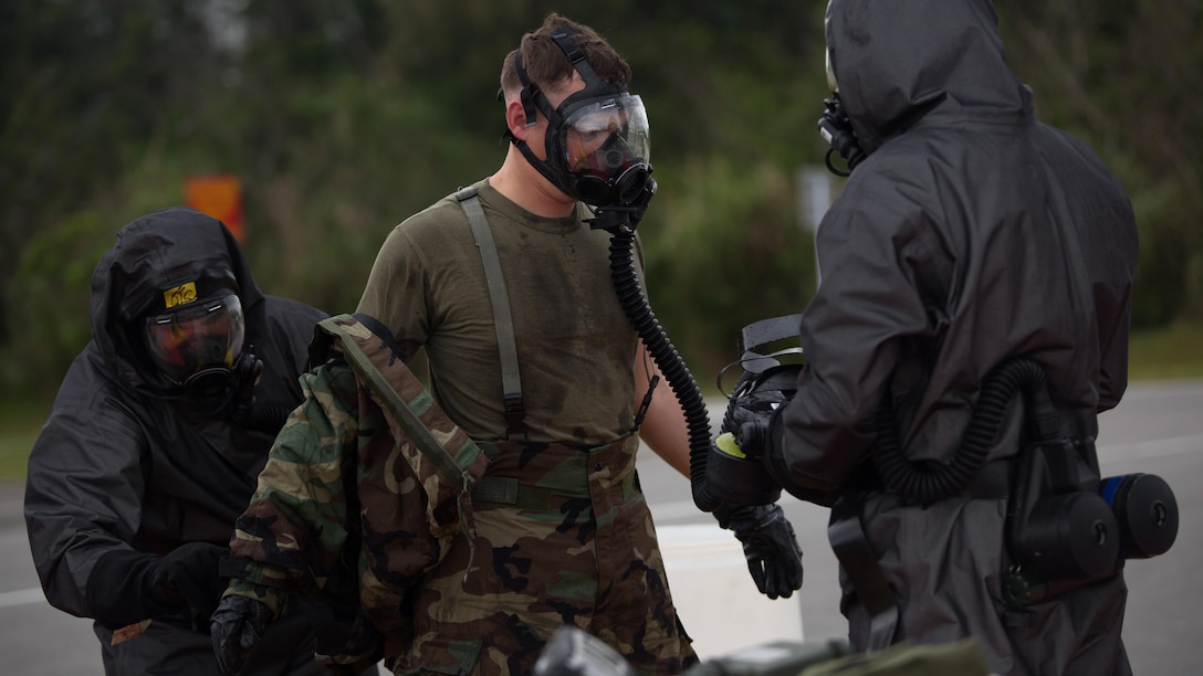 An explosive ordnance disposal technician undergoes the decontamination process after leak, seal, package and decontamination training April 21 at the gas chamber on Camp Hansen, Okinawa. The EOD technicians and Chemical, biological radiological, nuclear defense specialists used protective equipment to perform general decontamination of the affected area and prepare the leaking ordnance for safe containment and transport before completing the decontamination process. CBRN defense specialists assisted in familiarizing the EOD technicians with the decontamination line process and safe removal of protective gear after the leaking ordnance was successfully contained and removed from the original site. The training instilled the Marines’ confidence in their safety equipment and procedures used to mitigate CBRN-related hazards. The Marines are with 9th Engineer Support Battalion and Marine Logistics Group Headquarters Regiment, 3rd MLG, III Marine Expeditionary Force.