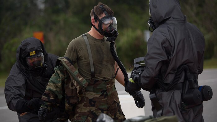 An explosive ordnance disposal technician undergoes the decontamination process after leak, seal, package and decontamination training April 21 at the gas chamber on Camp Hansen, Okinawa. The EOD technicians and Chemical, biological radiological, nuclear defense specialists used protective equipment to perform general decontamination of the affected area and prepare the leaking ordnance for safe containment and transport before completing the decontamination process. CBRN defense specialists assisted in familiarizing the EOD technicians with the decontamination line process and safe removal of protective gear after the leaking ordnance was successfully contained and removed from the original site. The training instilled the Marines’ confidence in their safety equipment and procedures used to mitigate CBRN-related hazards. The Marines are with 9th Engineer Support Battalion and Marine Logistics Group Headquarters Regiment, 3rd MLG, III Marine Expeditionary Force.