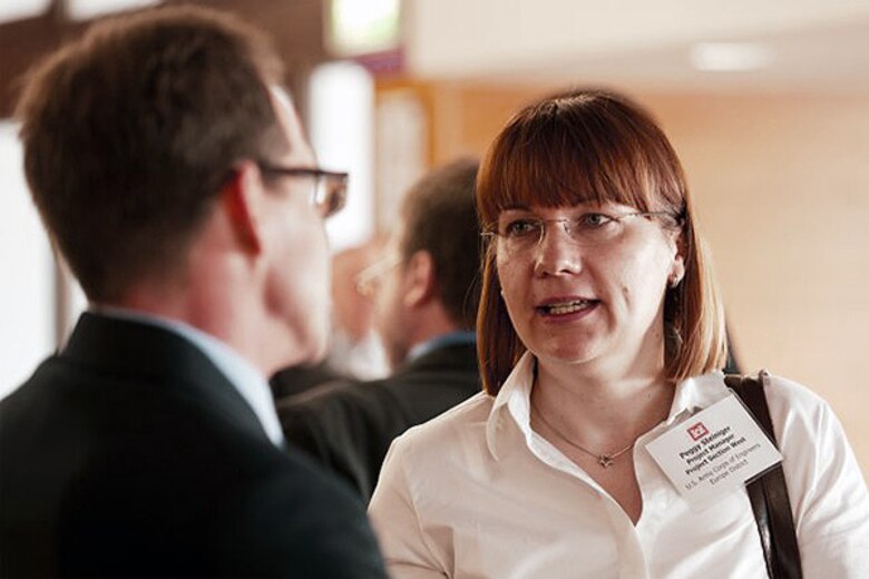 Peggy Steiniger, a project manager for U.S. Army Corps of Engineers Europe District, chats with a colleague April 15 on the opening day of the annual U.S.-German Partnering Conference in Trier, Germany.
