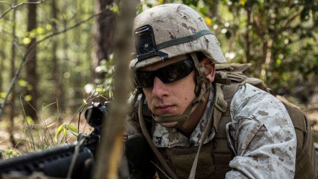 Lance Cpl. Richard Emmis, a rifleman with Charlie Company, 1st Battalion, 2nd Marine Regiment and native of Corona, California, posts security during a patrol to identify improvised explosive devices aboard Fort A.P. Hill, Virginia, April 21, 2015. Locating IEDs prepares Marines with 1st Bn., 2nd Marines for their upcoming deployment to Okinawa, Japan this fall. (U.S. Marine Corps photo by Lance Cpl. Immanuel Johnson/Released)