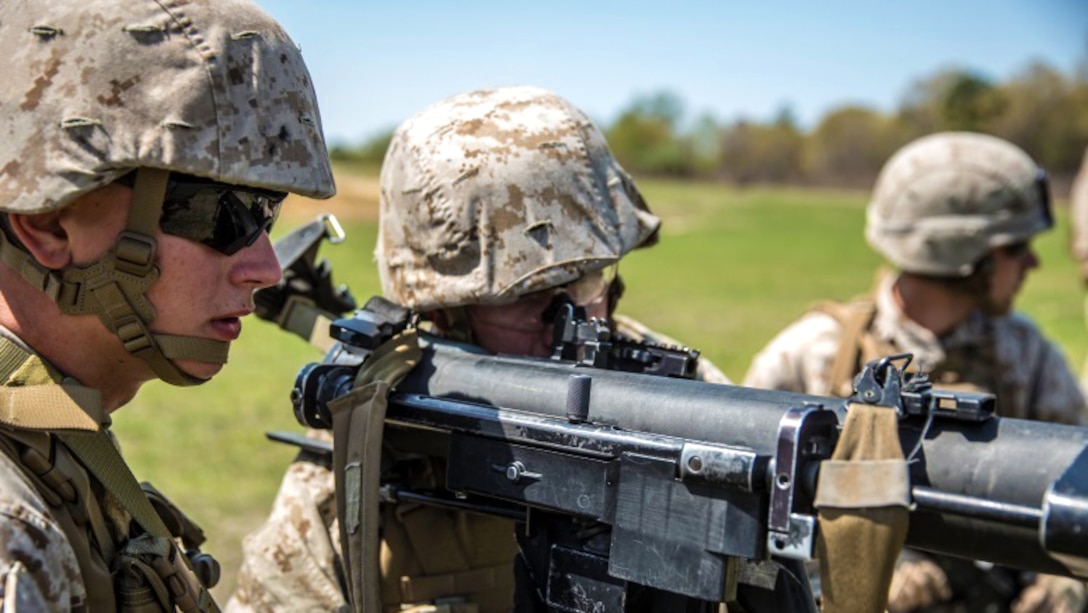 Marines with Alpha Company, 1st Battalion, 2nd Marine Regiment prepare to fire the M249 light machine gun aboard Fort A.P. Hill, Virginia, April 22, 2015. Familiarization with various weapon systems prepares Marines to operate in any environment with the M249 light machine gun.
