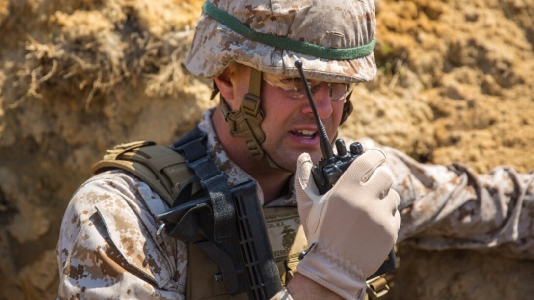 Second Lt. Michael Hanson, a platoon commander with Alpha Company, 1st Battalion, 2nd Marine Regiment and native of Yucaipa, California, confirms completion of the live-fire exercise aboard Fort A.P. Hill, Virginia, April 22, 2015. 1st Battalion, 2nd Marine Regiment is scheduled for an upcoming deployment to Okinawa, Japan, this August to increase the training level and unit continuity of Marine Corps units stationed in the continental United States. 