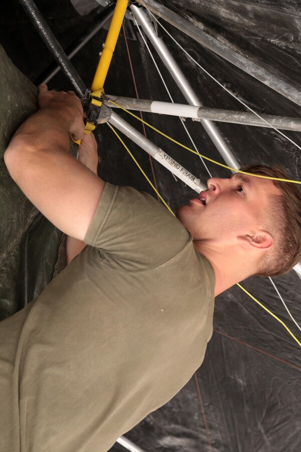 U.S. Marines with 13th Marine Expeditionary Unit practice setting up a combat operations center (COC) aboard Camp Pendleton, Calif. April 27, 2015.
