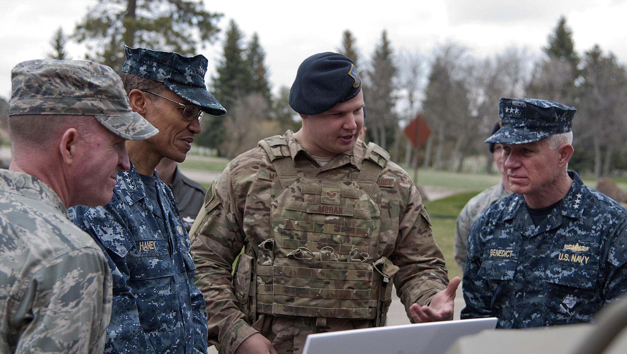 Staff Sgt. Sean Moran briefs Navy Adm. Cecil D. Haney, the U.S. Strategic Command commander; Lt. Gen. Stephen W. Wilson, Air Force Global Strike Command commander; and Navy Vice Adm. Terry Benedict, U.S. Navy Strategic Systems Program director; on a wave relay tactical assault kit radio during a visit to F.E. Warren Air Force Base, Wyo., April 28, 2015. Haney, Wilson and Benedict traveled to F.E. Warren to see the men and women performing the intercontinental ballistic missile mission and to attend the ICBM stakeholders’ meeting. Moran is assigned to the 90th Security Forces Support Squadron. (U.S. Air Force photo/Airman 1st Class Brandon Valle)