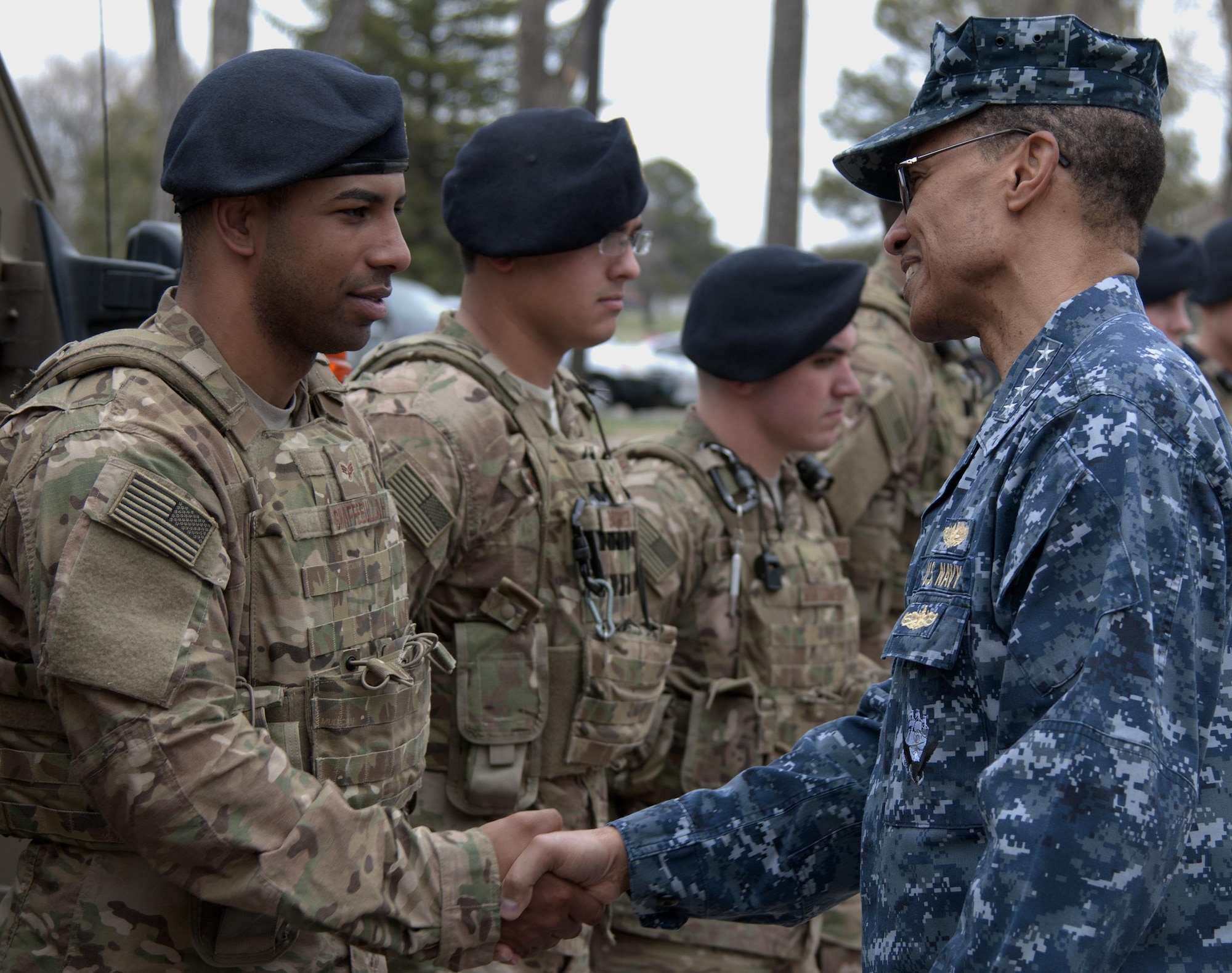 Navy Adm. Cecil D. Haney, the U.S. Strategic Command commander, shakes hands with Senior Airman Shaan Shaffeeullah, a 790th Missile Security Forces Squadron convoy response force member, during a visit to F.E. Warren Air Force Base, Wyo., April 28, 2015. Haney traveled to F.E. Warren to see firsthand the men and women performing the intercontinental ballistic missile mission and to chair the ICBM stakeholders’ meeting. (U.S. Air Force photo/Airman 1st Class Brandon Valle)