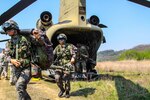 In this file photo, South Korean soldiers, from the 603rd Air Assault Battalion, unload a CH-47 Chinook at LZ, a northern part of TTA TOM, in South Korea, April 21, 2015.