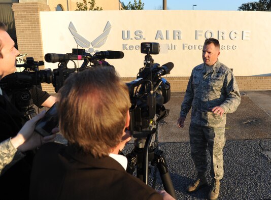 Brig. Gen. Patrick Higby, the 81st Training Wing commander, addresses local media during a press conference Feb. 11, 2015, on the flightline at Keesler Air Force Base, Miss. From his cradle in a small village in western Germany to the position of the 81st Training Wing commander, Higby has learned the value of being a military child . (U.S. Air Force photo/Kemberly Groue)