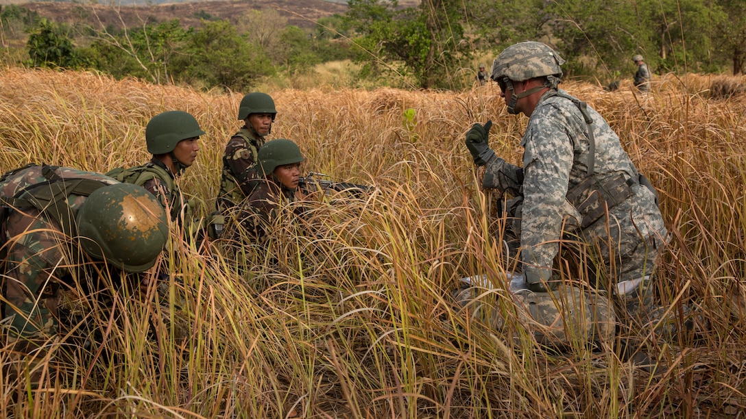 A U.S. Soldier assigned to the 1st Battalion, 27th Infantry Regiment, 2nd Stryker Brigade Combat Team, 25th Infantry Division, briefs information to Philippine Army Soldiers assigned to the 7th Infantry Division during a field training exercise at Fort Magsaysay, Philippines, April 20, 2015. The training occurred during joint training exercise Balikatan 2015. Bilateral training exercises, such as Balikatan, improve the readiness of both armed forces, help maintain a high level of readiness, enhance military-to-military relations and combined combat capabilities.