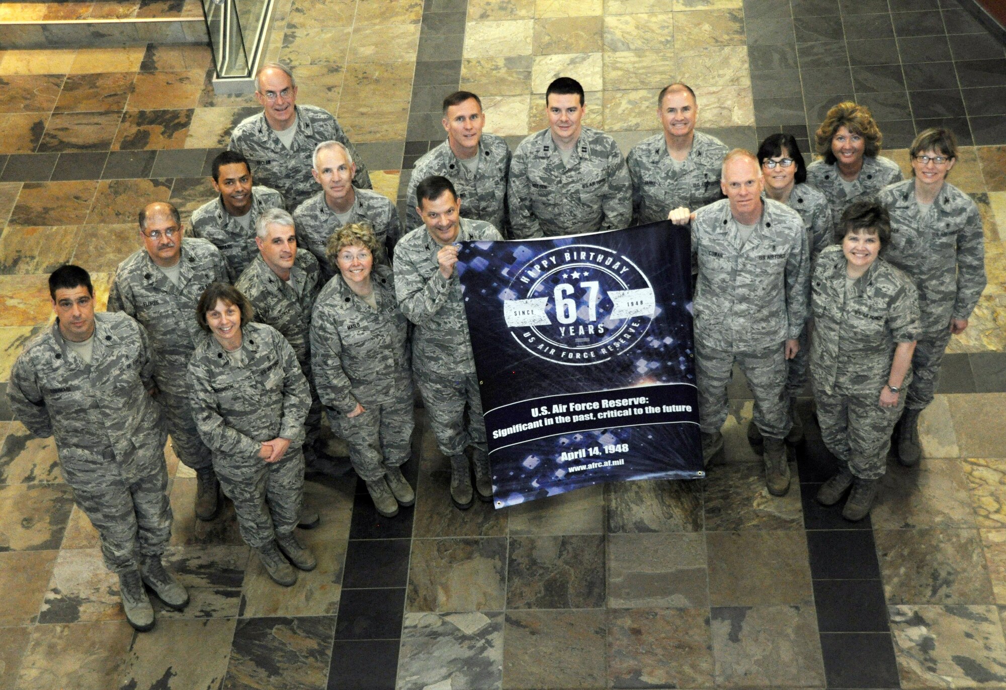 In honor of the Air Force Reserve's 67th anniversary, Air Reserve Personnel Center took photos with a commemorative banner at various events. Members from the Biomedical Science Corps pose for a photo April 9, 2015, on Buckley Air Force Base, Colo. (U.S. Air Force photo/Tech. Sgt. Rob Hazelett)