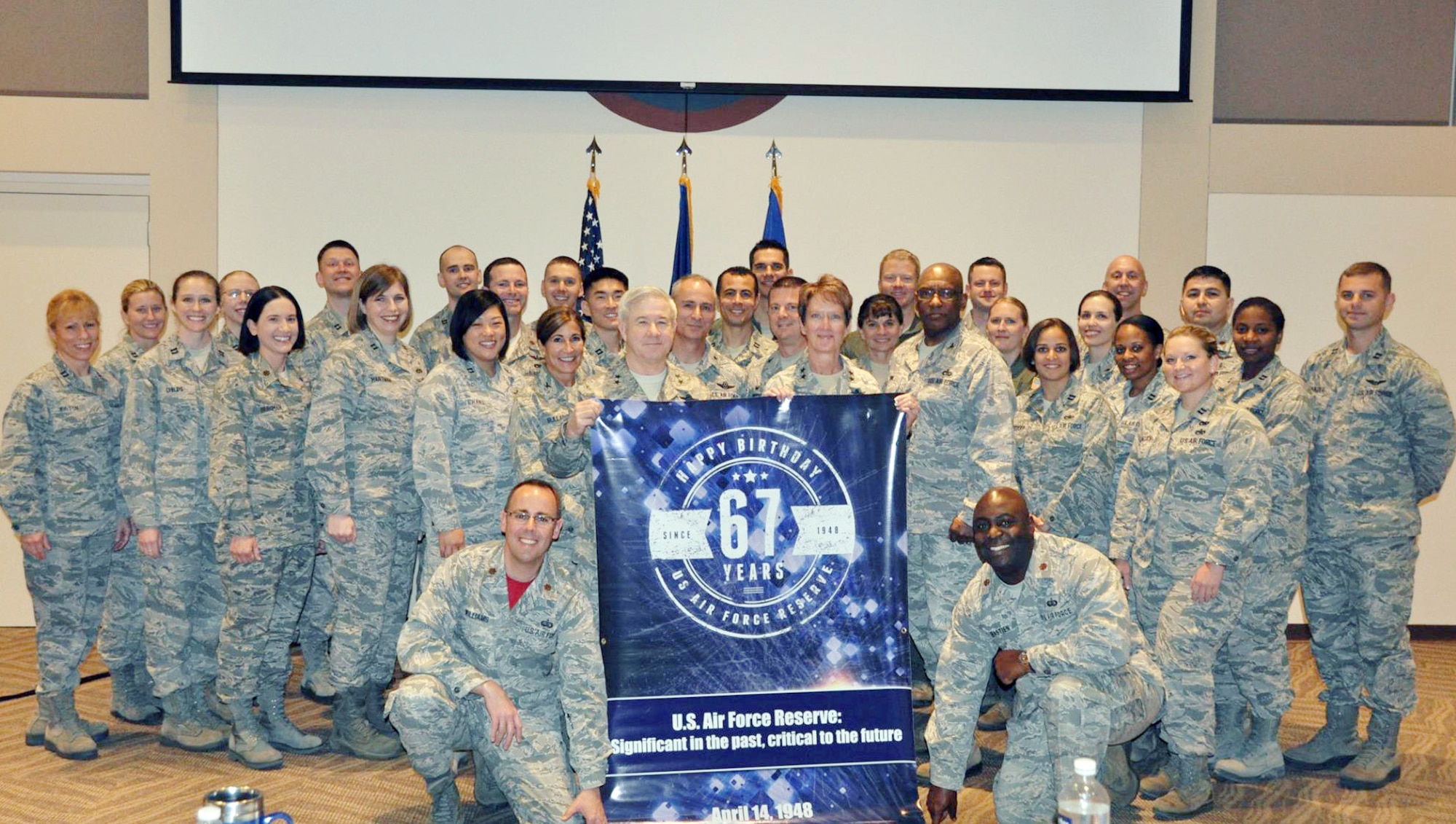 In honor of the Air Force Reserve's 67th anniversary, Air Reserve Personnel Center took photos with a commemorative banner at various events. Members of ARPC and visiting leaders from the Air Force Reserve Command pose for a shot during the Reserve Officer Development Course April 24, 2015, on Buckley Air Force Base, Colo. (U.S. Air Force photo/Tech. Sgt. Robert Hazelett)