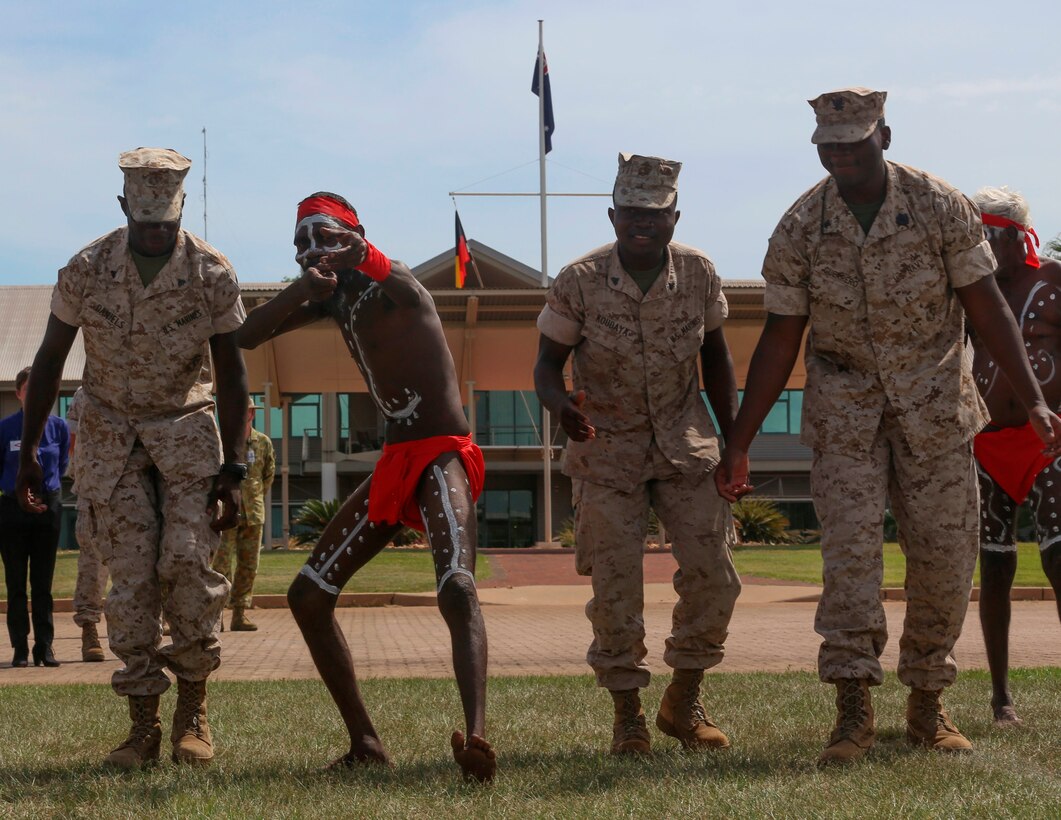 U.S. Marines with Marine Rotational Force – Darwin dance with aboriginals during a “Welcome to Country” ceremony April 22 at Robertson Barracks, Palmerston, Australia. Brigadier Mick Ryan, commander, 1st Brigade, Australian Army, Australian Defence Force, spoke about the relationship between the Marines and Australians during the MRF-D deployment, and introduced Marines to aboriginal culture by inviting the Kenbi Dancers to conduct a welcoming performance. MRF-D is the deployment of U.S. Marines to Darwin and the Northern Territory, for approximately six months at a time, where they will conduct exercises and training on a rotational basis with the ADF. (U.S. Marine Corps photo by Lance Cpl. Kathryn Howard/Released)
