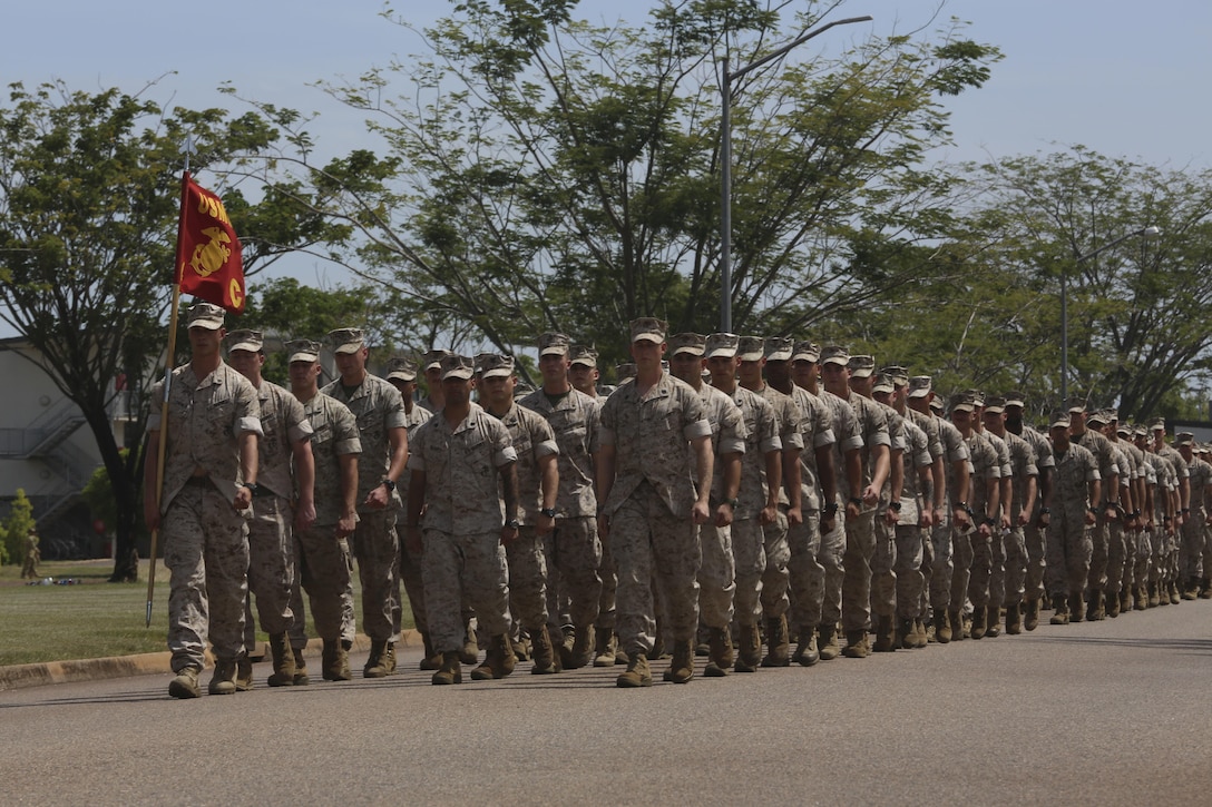 U.S. Marines with Company C, 1st Battalion, 4th Marine Regiment, Marine Rotational Force – Darwin, march onto the Brigade Parade Ground for a “Welcome to Country” ceremony April 22 at Robertson Barracks, Palmerston, Australia. Brigadier Mick Ryan, commander, 1st Brigade, Australian Army, Australian Defence Force, spoke about the relationship between the Marines and Australians during the MRF-D deployment, and introduced Marines to aboriginal culture by inviting the Kenbi Dancers to conduct a welcoming performance. MRF-D is the deployment of U.S. Marines to Darwin and the Northern Territory, for approximately six months at a time, where they will conduct exercises and training on a rotational basis with the ADF. (U.S. Marine Corps photo by Lance Cpl. Kathryn Howard/Released)