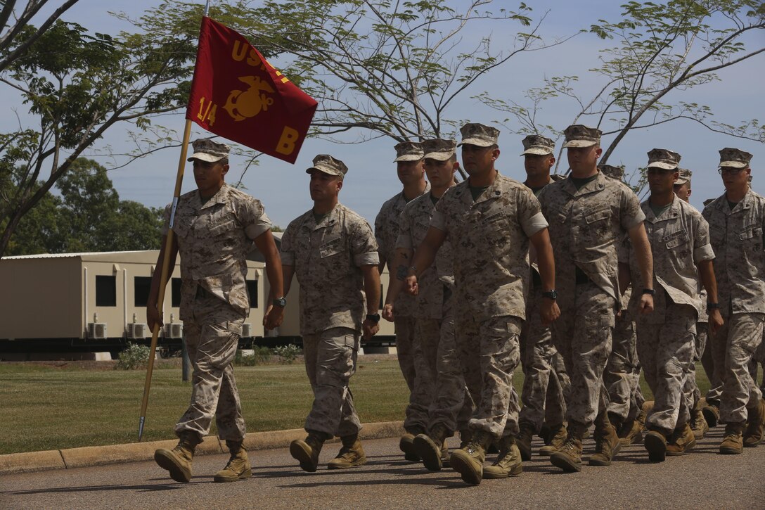 U.S. Marines with Company B, 1st Battalion, 4th Marine Regiment, Marine Rotational Force – Darwin, march onto the Brigade Parade Ground for a “Welcome to Country” ceremony April 22 at Robertson Barracks, Palmerston, Australia. Brigadier Mick Ryan, commander, 1st Brigade, Australian Army, Australian Defence Force, spoke about the relationship between the Marines and Australians during the MRF-D deployment, and introduced Marines to aboriginal culture by inviting the Kenbi Dancers to conduct a welcoming performance. MRF-D is the deployment of U.S. Marines to Darwin and the Northern Territory, for approximately six months at a time, where they will conduct exercises and training on a rotational basis with the ADF. (U.S. Marine Corps photo by Lance Cpl. Kathryn Howard/Released)