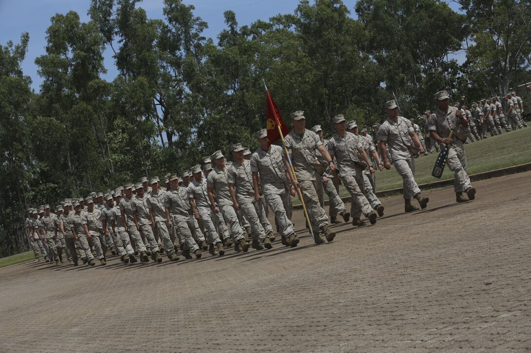 U.S. Marines with Company A, 1st Battalion, 4th Marine Regiment, Marine Rotational Force – Darwin, march onto the Brigade Parade Ground for a “Welcome to Country” ceremony  April 22 at Robertson Barracks, Palmerston, Australia. Brigadier Mick Ryan, commander, 1st Brigade, Australian Army, Australian Defence Force, spoke about the relationship between the Marines and Australians during the MRF-D deployment, and introduced Marines to aboriginal culture by inviting the Kenbi Dancers to conduct a welcoming performance. MRF-D is the deployment of U.S. Marines to Darwin and the Northern Territory, for approximately six months at a time, where they will conduct exercises and training on a rotational basis with the ADF. (U.S. Marine Corps photo by Lance Cpl. Kathryn Howard/Released)