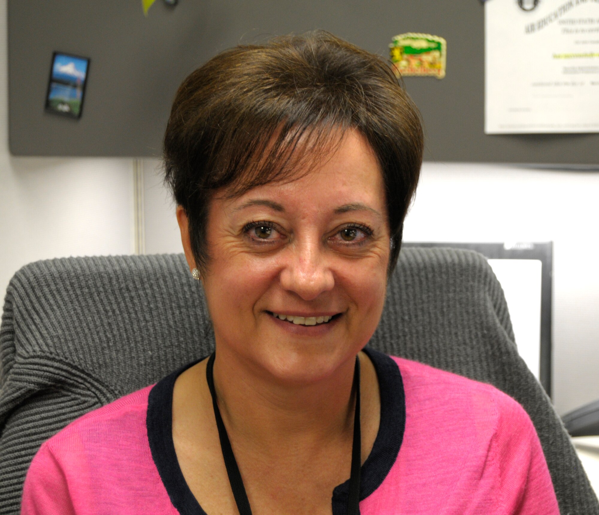 Lynn Hickam, Air Force Reserve Command logistics training manager, poses for a photo at her desk on Robins Air Force Base, Ga., April 29, 2015. Hickam comes in once a month, every other month, to better communicate with her units out in the field. (U.S. Air Force photo by Staff Sgt. Sarah Hanson/RELEASED)