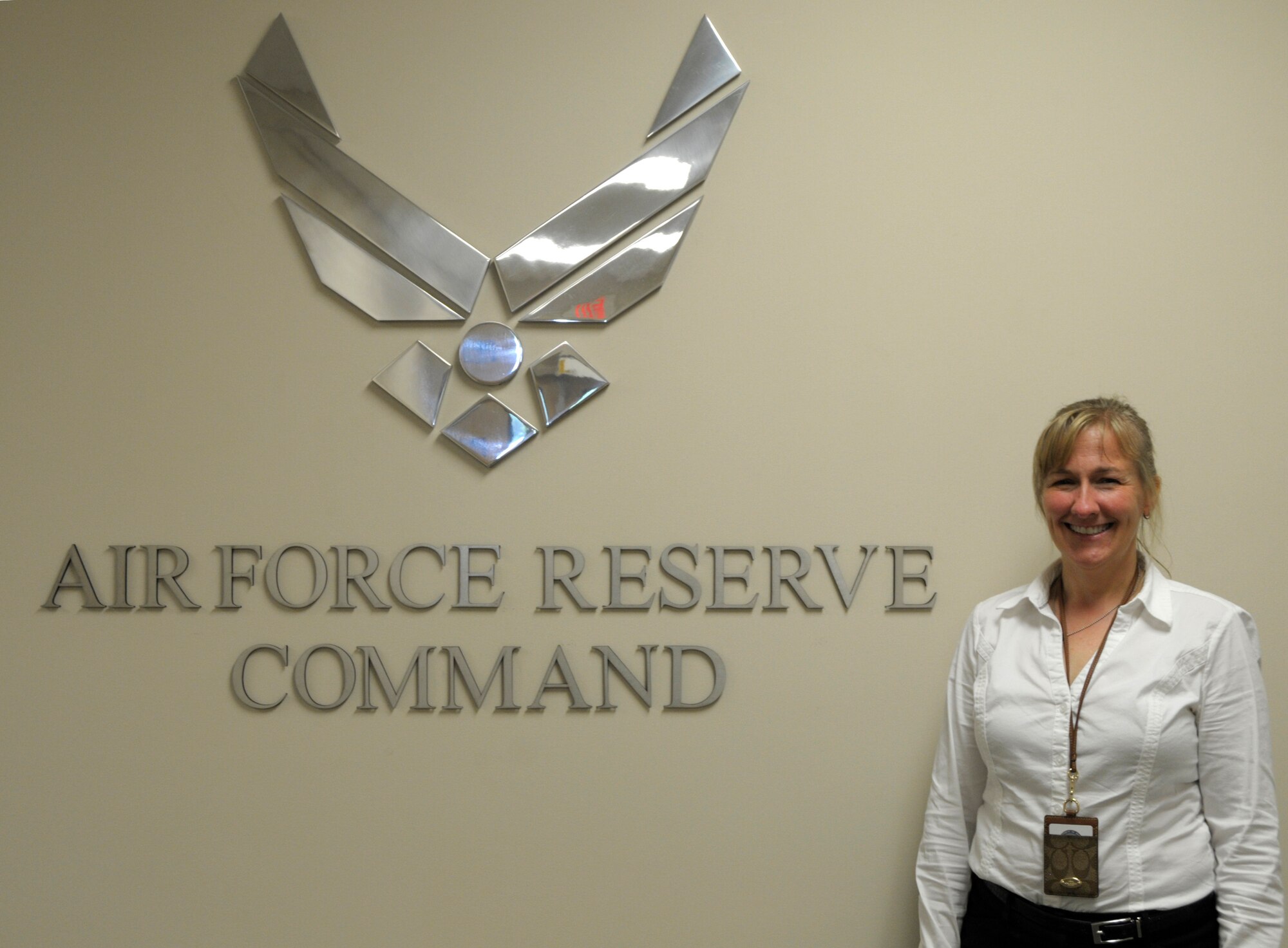 Bonnie Bast, Air Force Reserve Command aerial port functional area manager, poses for a photo in her work building on Robins Air Force Base, Ga., April 29, 2015. Bast likes to help Reservists find opportunities to serve in missions that help impact the world and make a difference. (U.S. Air Force photo by Staff Sgt. Sarah Hanson/RELEASED) 