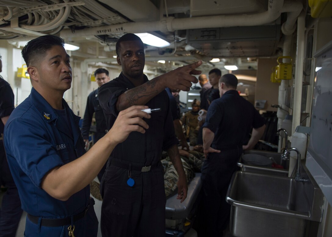 Sailors participate in mass casualty training aboard the forward deployed amphibious transport dock ship USS Green Bay (LPD 20). Green Bay is part of the Bonhomme Richard Amphibious Ready Group and, with the embarked 3rd Marine Division Forward, is currently participating in exercise Balikatan 2015, an annual bilateral exercise conducted with members of the armed forces of the Republic of the Philippines.
