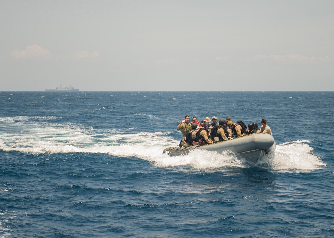 Sailors depart the amphibious transport dock ship USS Green Bay (LPD 20) during a visit, board, search and seizure (VBSS) training evolution. Green Bay is part of the Bonhomme Richard Amphibious Ready Group and, with the embarked 3rd Marine Expeditionary Force, is currently participating in exercise Balikatan 2015.