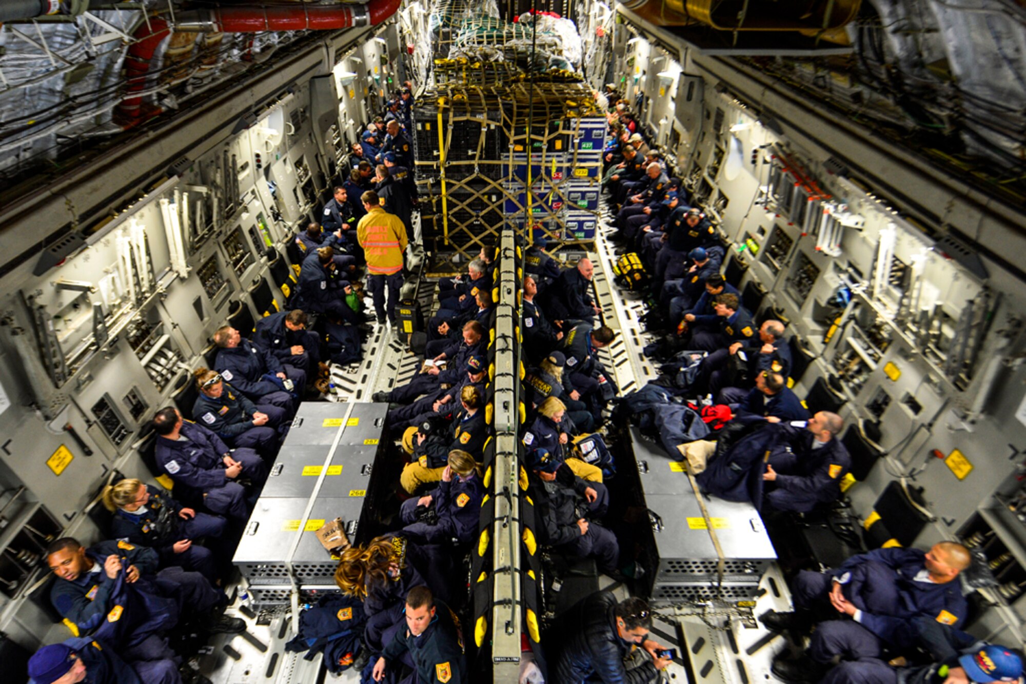 In this photo file, Sixty-nine members of the Fairfax County Urban Search and Rescue Team await takeoff on a U.S. Air Force C-17 Globemaster III at Dover Air Force Base, Del., April 26, 2015. The specially trained team and approximately 70,000 pounds of their supplies are deploying to Nepal to assist with rescue operations after the country was struck by a 7.8-magnitude earthquake.  