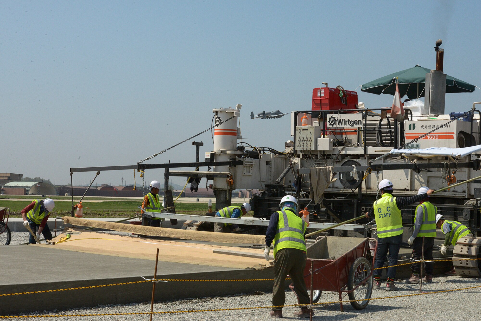 Republic of Korea contractors work on the construction of the second runway April 30, 2015, at Osan Air Base, Republic of Korea. The construction involves coordination between U.S. and ROK agencies. (U.S. Air Force photo by Staff Sgt. Jake Barreiro/Released)