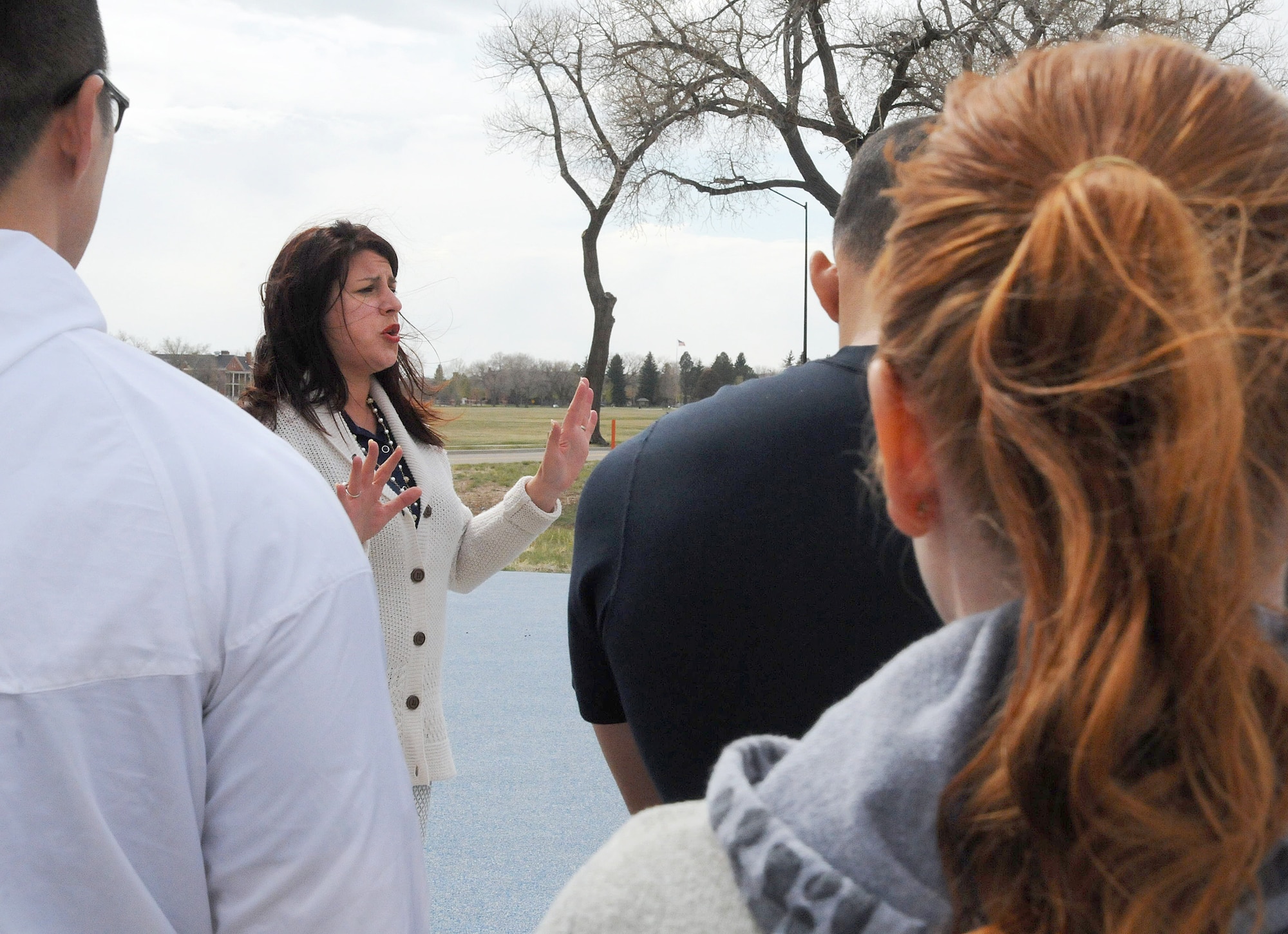 Jill Randall, 90th Missile Wing Sexual Assault Response Coordinator, talks with runners prior to the Warren SAPR Awareness 5K Run April 24, 2015, on F.E. Warren Air Force Base, Wyo. The run was the first event held by Randall after her assumption of the position. (U.S. Air Force photo by Airman 1st Class Malcolm Mayfield)