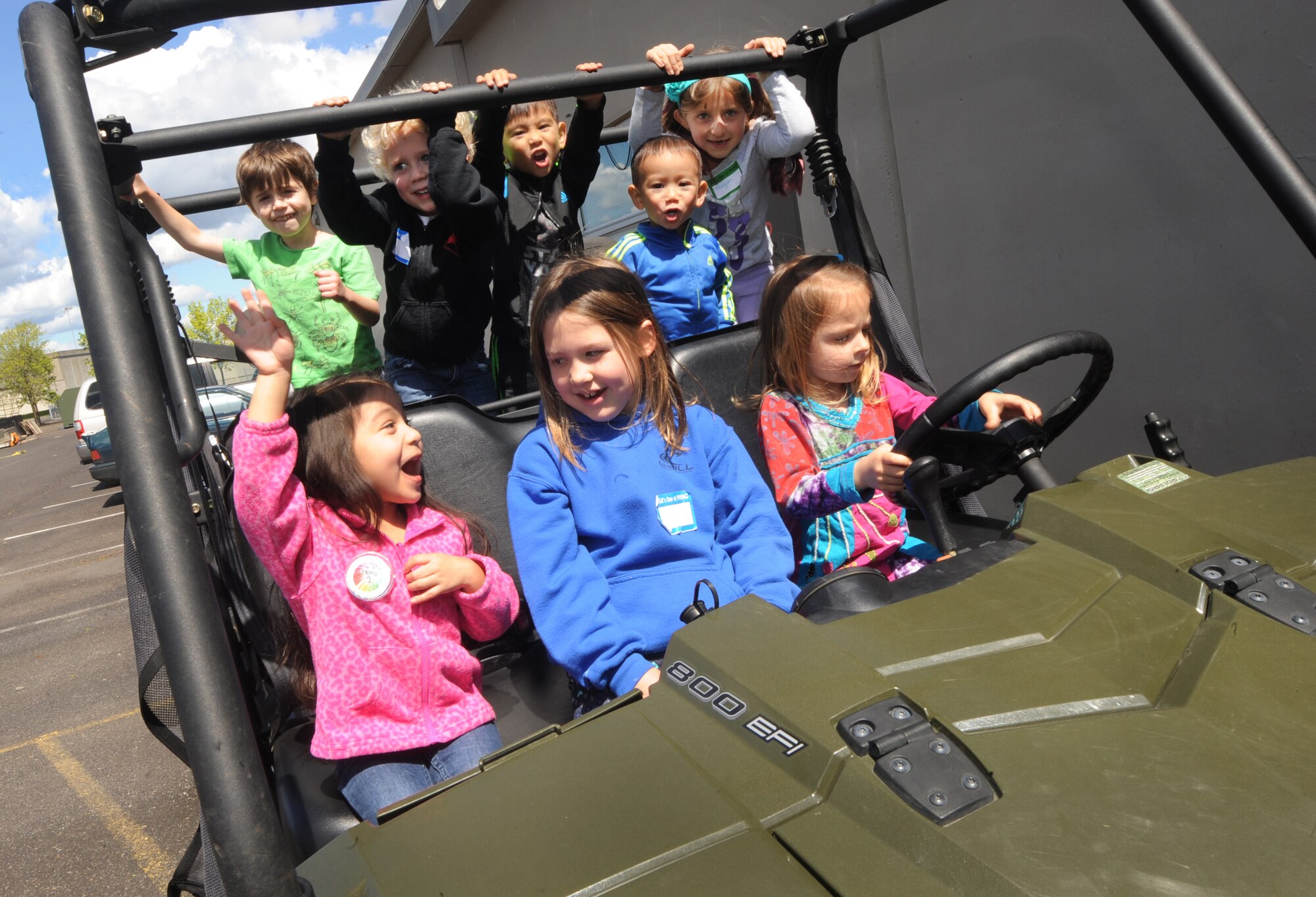 A group of kids attending ‘Kids Day at PANG’ play inside one of the many vehicles used my military personnel at the Portland Air National Guard Base, Ore., April 25, 2015. The Oregon National Guard opened the Portland Air Base to children of military members for a special day of activities highlighting “The Month of the Military Child,” designated since 1986 by the Department of Defense as way to recognize the contribution and personal sacrifices children make to the military. (U.S. Air National Guard photo by Tech. Sgt. John Hughel, 142nd Fighter Wing Public Affairs/Released)