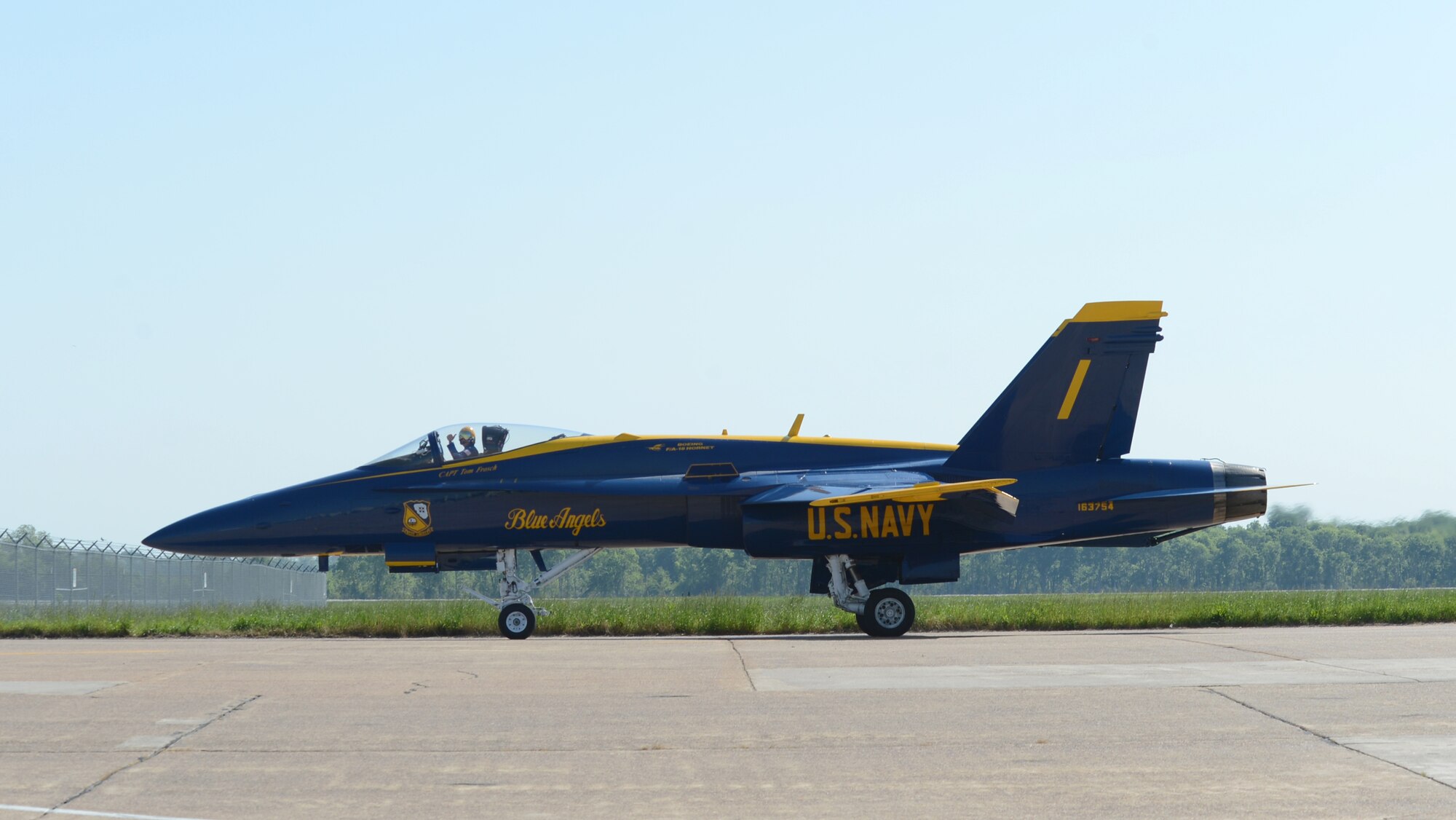 Capt. Tom Frosch, U.S. Navy Flight Demonstration Team Blue Angels commanding officer, gives the thumbs up after landing on Barksdale Air Force Base, Louisiana, April 30, 2015. The Blue Angels, based at Naval Air Station Pensacola, Florida, is the Navy's premier aerial demonstration team, performing at air shows and special events worldwide. (U.S. Air Force photo/Senior Airman Benjamin Gonsier)