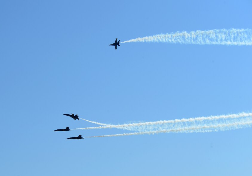 The U.S. Navy Flight Demonstration Team Blue Angels F/A-18 Hornets practice an aerial maneuver for the Defenders of Liberty Air Show on Barksdale Air Force Base, Louisiana, April 30, 2015. The mission of the Blue Angels is to showcase the pride and professionalism of the United States Navy and Marine Corps by inspiring a culture of excellence and service to country through flight demonstrations and community outreach. (U.S. Air Force photo/Senior Airman Benjamin Gonsier)