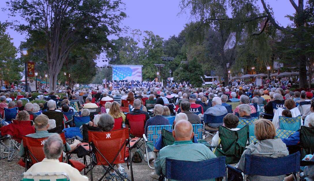 An audience of over 2,500 people enjoy the USAF Heritage of America Band and the USA Training and Doctrine Command Band, as they present a joint concert in Williamsburg, Virginia, in celebration of Constitution Day, Sep. 17, 2014. (U. S. Air Force photo by Raymond Landon)