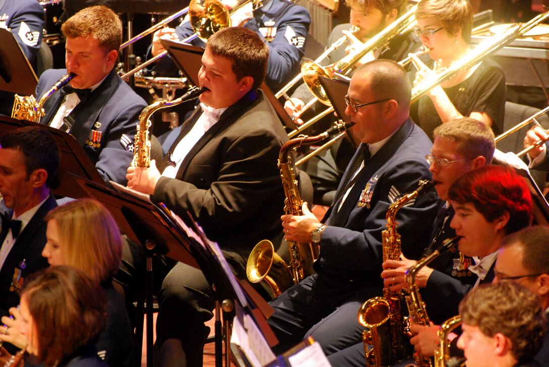 Members of the USAF Heritage of America Band perform alongside music students from Christopher Newport University, in a joint concert presented at the Ferguson Center for the Arts, Oct. 9, 2014.  The event was held as a part of the Heritage of America Band's community and civic outreach mission.  (U.S. Air Force photo by Raymond Landon)