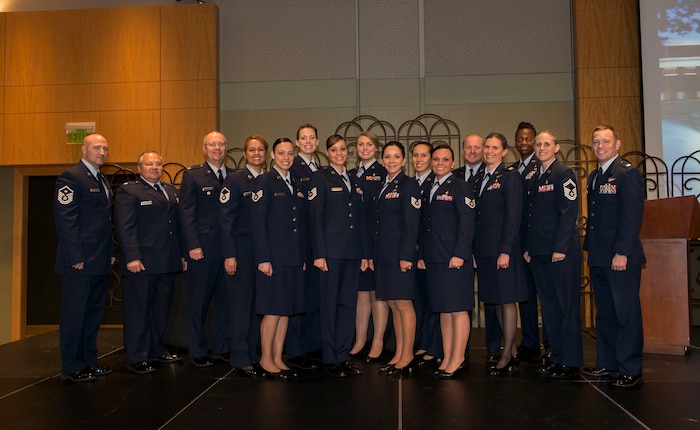 Airmen and leadership from the 628th Aerospace Medicine Squadron, 628th Medical Group and the Air Force Dental Corps pose for a group photo with three graduates of a dental hygiene program April 29, 2015 at Trident Technical College in Charleston, S.C. The dental hygiene training scholarship program currently allows four dental assistants to attend Trident Technical College full time while remaining on active duty. The new dental hygienists are Technical Sgt. Terina Waiganjo, and Staff Sgts. Sandy Molina and Hollynd Walker. (U.S. Air Force photo/Senior Airman Jared Trimarchi)