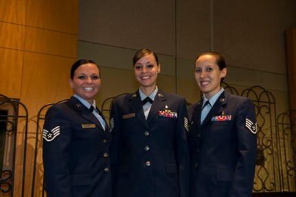 Technical Sgt. Terina Waiganjo (center), and Staff Sgts. Sandy Molina (right) and Hollynd Walker (left) became the Air Force’s newest dental hygienists during a pinning ceremony April 29, 2015, at Trident Technical College in Charleston, S.C. The dental hygiene training scholarship program currently allows four dental assistants to attend Trident Technical College full time for one year while remaining on active duty. (U.S. Air Force photo/Senior Airman Jared Trimarchi) 