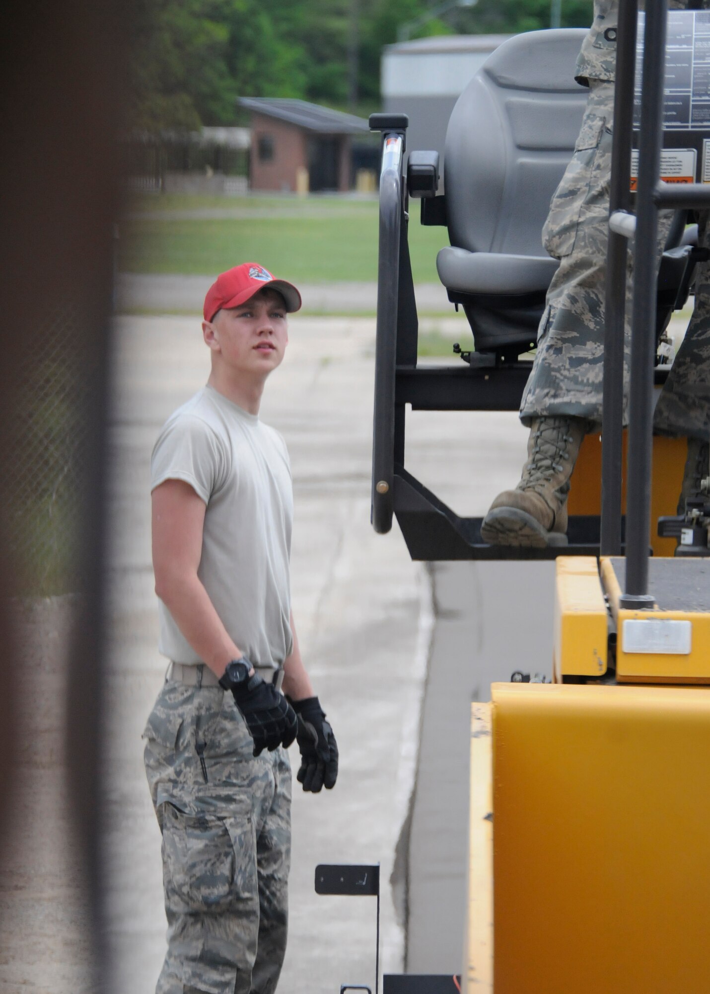 Airman 1st Class Andrew Sneeringer inspects the asphalt paving machine April 21, 2015, during annual training at Ebbing Air National Guard Base, Ark. Sneeringer participated in milling and asphalt training throughout his two weeks of training. Engineers must recertify these skills every three years. Sneeringer is assigned to the Ohio Air National Guard’s 200th Rapid Engineer Deployable Heavy Operational Repair Squadron Engineer Squadron. (U.S. Air National Guard photo by Staff Sgt. Hannah Dickerson/released)