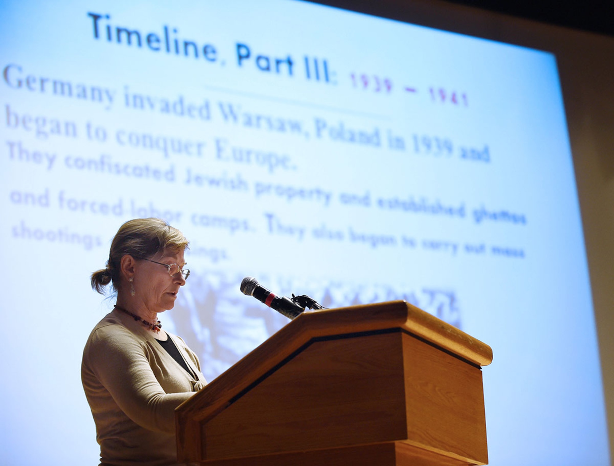 Alaska Jewish Museum Curator and guest speaker, Leslie Fried, explains why it is important to never forget the memory of the millions of people killed during the Holocaust, as well as the survivors, Soldiers and resistance who bore witness to these events during the Holocaust Remembrance Day at the Talkeetna Theater on JBER April 24. The days of remembrance were established to memorialize the six millions Jews murdered in the Holocaust of Nazi persecutions. It is to raise awareness that democratic institutions and values are not simply sustained, but need to be appreciated, nurtured and protected. (U.S. Air Force photo/Staff Sgt. Sheila deVera)