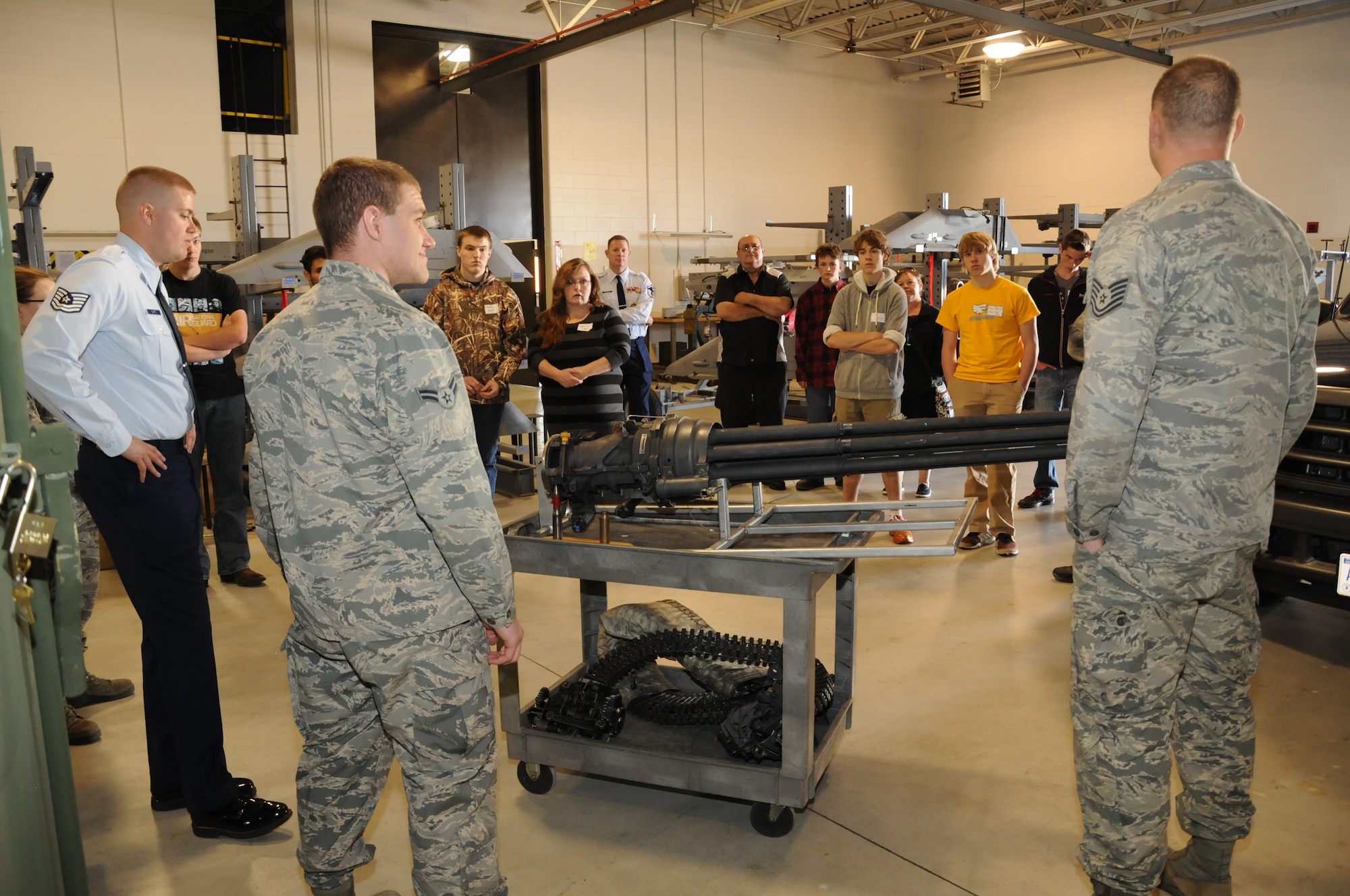 High school students and their parents listen to Airmen from the 114th Fighter Wing weapon shop during the 2015 South Dakota Air National Guard Career Day at Joe Foss Field, S.D., April 29, 2015. The event was held to showcase the many careers within the South Dakota Air National Guard to area high school seniors and juniors.  (National Guard photo by Senior Airman Duane Duimstra/Released)