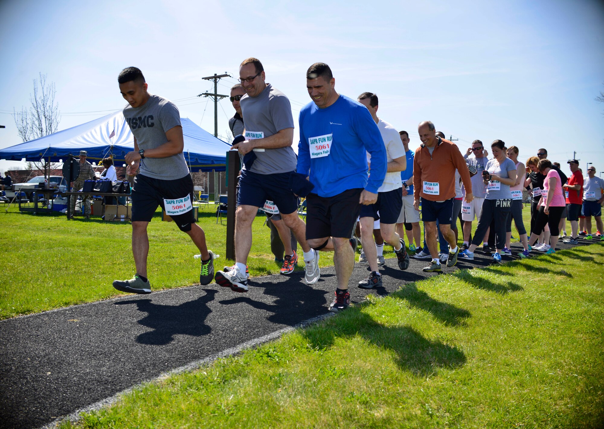 In honor of Sexual Assault Awareness and Prevention month, members of all Military branches participate in the SAPR fun run held at Niagara Falls Air Reserve Station, N.Y., April 29, 2015. The run entails two miles around the base track with various activities along the way, from Self Aid Buddy Care to jumping jacks. (U.S. Air Force photo by Tech. Sgt. Stephanie Sawyer)