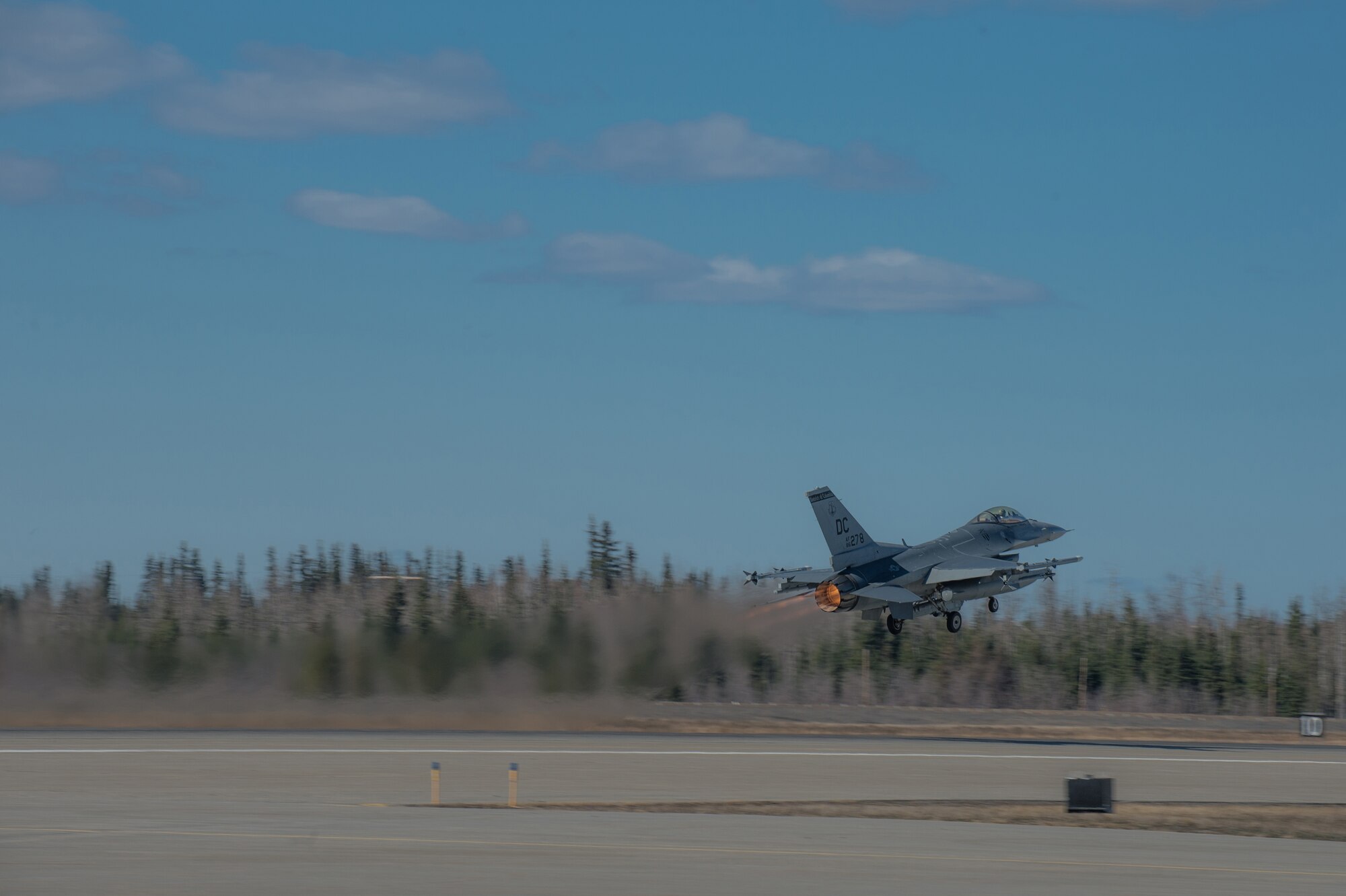 An F-16 Fighting Falcon pilot from the 113th Wing, District of Columbia Air National Guard, takes off from the flight line April 27, 2015 at Eielson Air Force Base, Alaska. The unit is preparing to participate in RED FLAG-Alaska 15-2 large-force employment training. (U.S. Air Force photo by Staff Sgt. Shawn Nickel/Released)