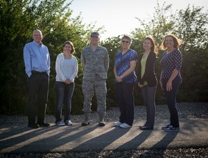 Family Advocacy members pose for a photo at Mountain Home Air Force Base, Idaho, April 30, 2015. Family Advocacy offers many services to help families live safe, happy and healthy lifestyles. (U.S. Air Force photo by Airman 1st Class Jessica H. Smith/RELEASED)