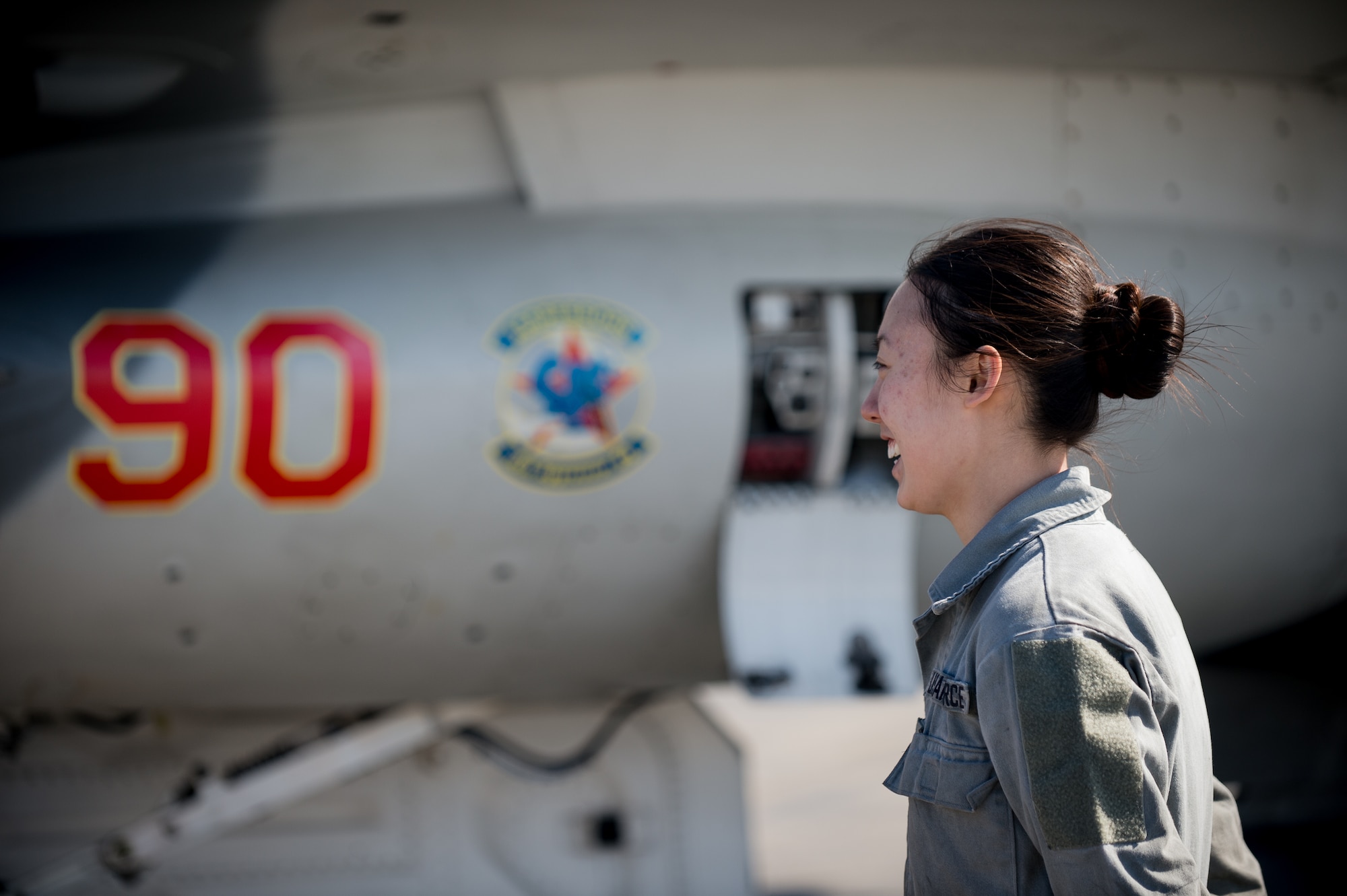 U.S. Air Force Senior Airman Michelle Park, a 354th Aircraft Maintenance Squadron assistant dedicated crew chief, stands in front of an F-16 Fighting Falcon at Eielson Air Force Base, Alaska, April 27, 2015. As a crew chief, Park is a tactical aircraft maintainer who ensures her assigned jet is ready to fly at a moments notice. (U.S. Air Force photo by Staff Sgt. Shawn Nickel/Released)