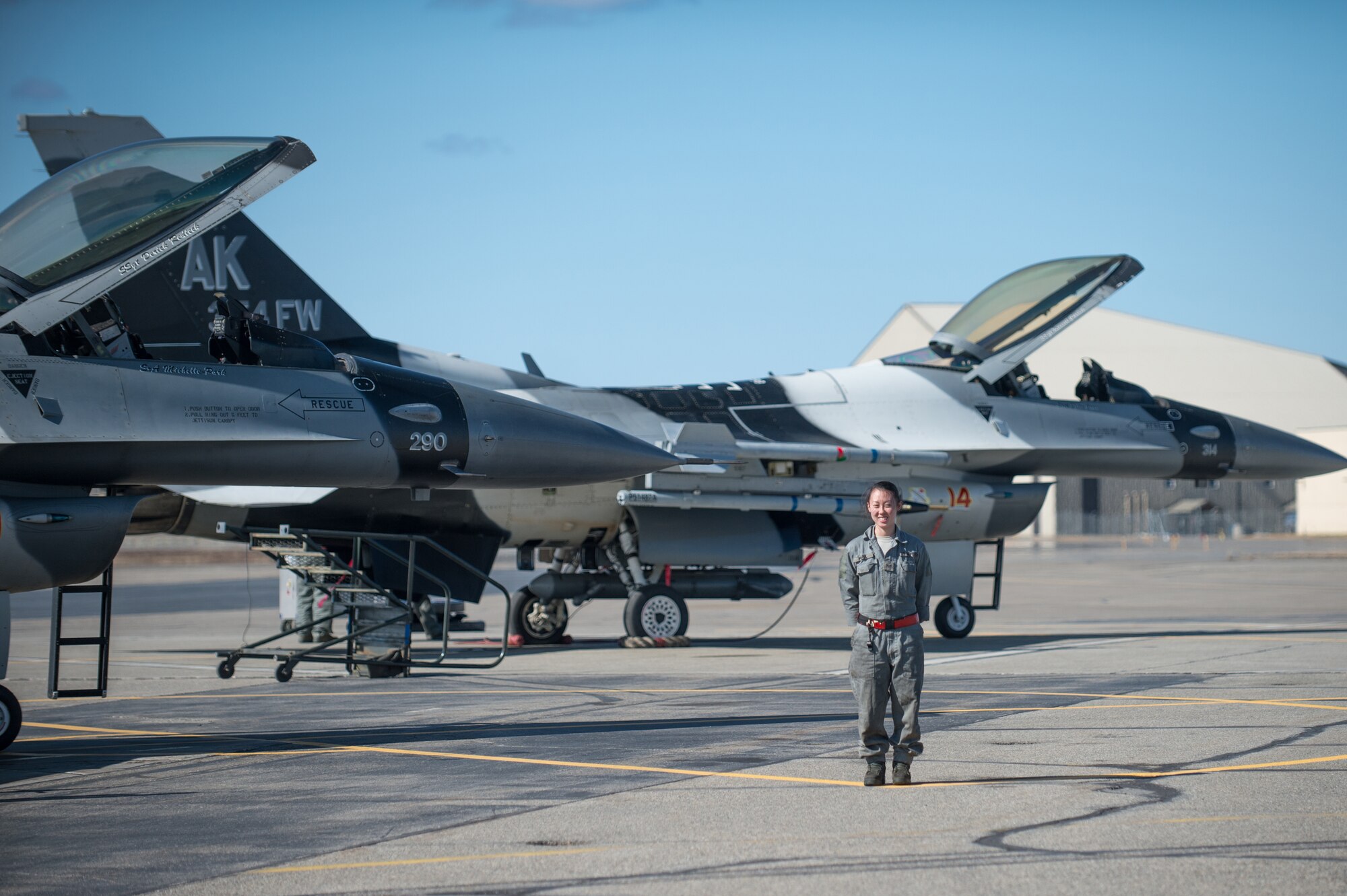 U.S. Air Force Senior Airman Michelle Park, a 354th Aircraft Maintenance Squadron assistant dedicated crew chief, stands in front of an F-16 Fighting Falcon at Eielson Air Force Base, Alaska, April 27, 2015. As a crew chief, Park is a tactical aircraft maintainer who ensures her assigned jet is ready to fly at a moments notice. (U.S. Air Force photo by Staff Sgt. Shawn Nickel/Released)