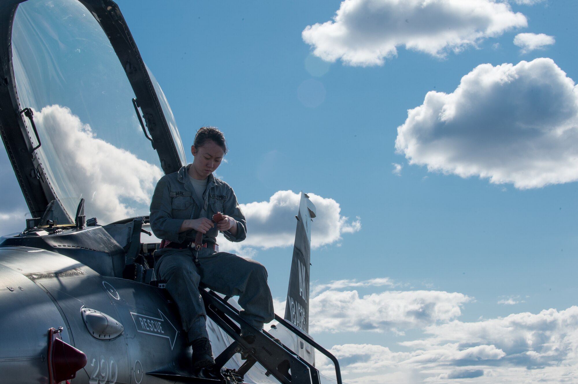 U.S. Air Force Senior Airman Michelle Park, a 354th Aircraft Maintenance Squadron assistant dedicated crew chief, works on an F-16 Fighting Falcon at Eielson Air Force Base, Alaska, April 27, 2015. Park will work with a pilot to launch the jet safely and also keep track of maintenance on the aircraft. (U.S. Air Force photo by Staff Sgt. Shawn Nickel/Released)