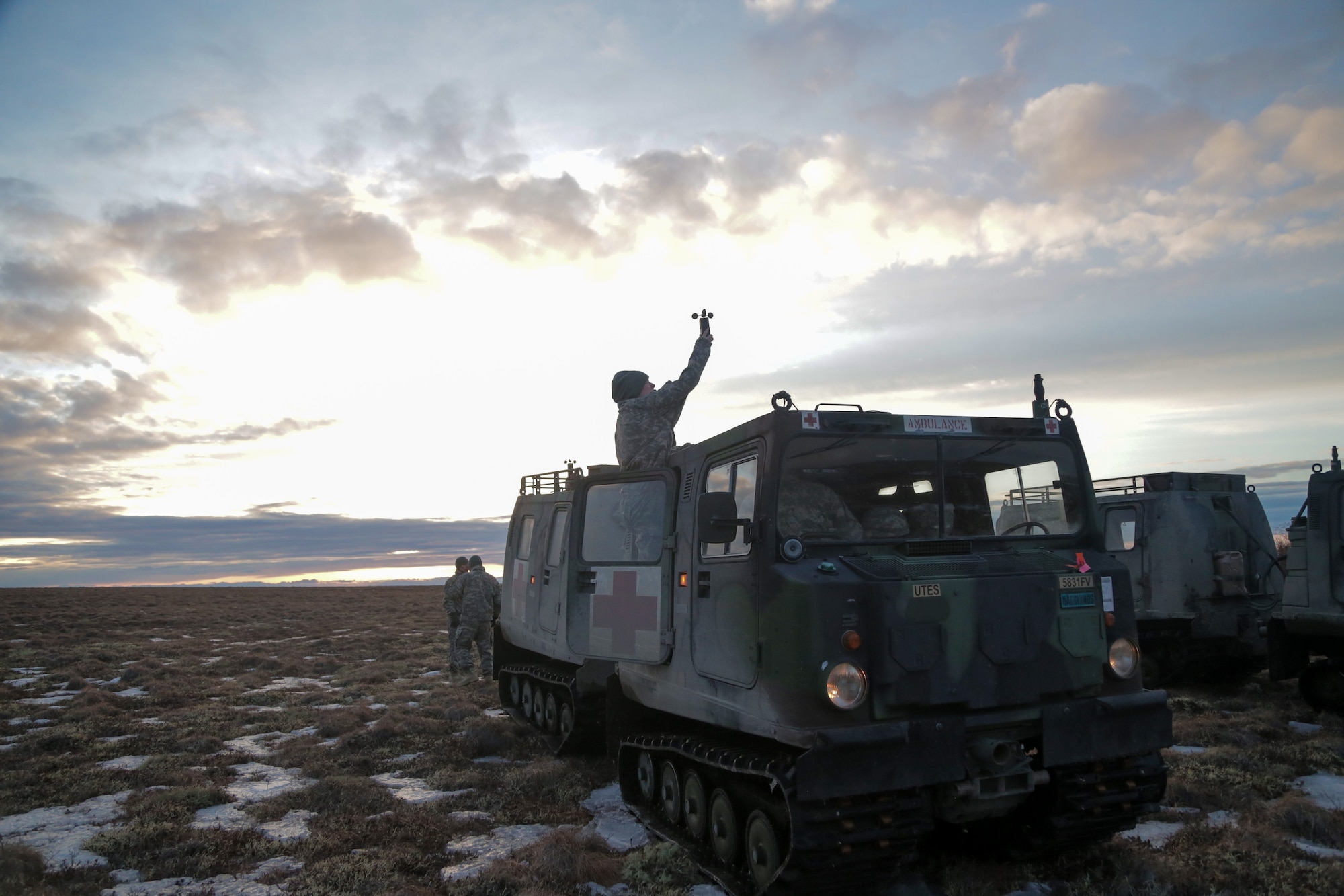 Staff Sgt. Michelle Gelner, a parachute rigger for the 4th Quartermaster Company, Joint Base Elmendorf-Richardson, uses a DIC-3 anemometer to measure wind speed in order to ensure the safety of 31 Soldiers who are scheduled to participate in airborne operations in Bethel, Alaska, March 27. (U.S. Army National Guard photo by Sgt. Marisa Lindsay)