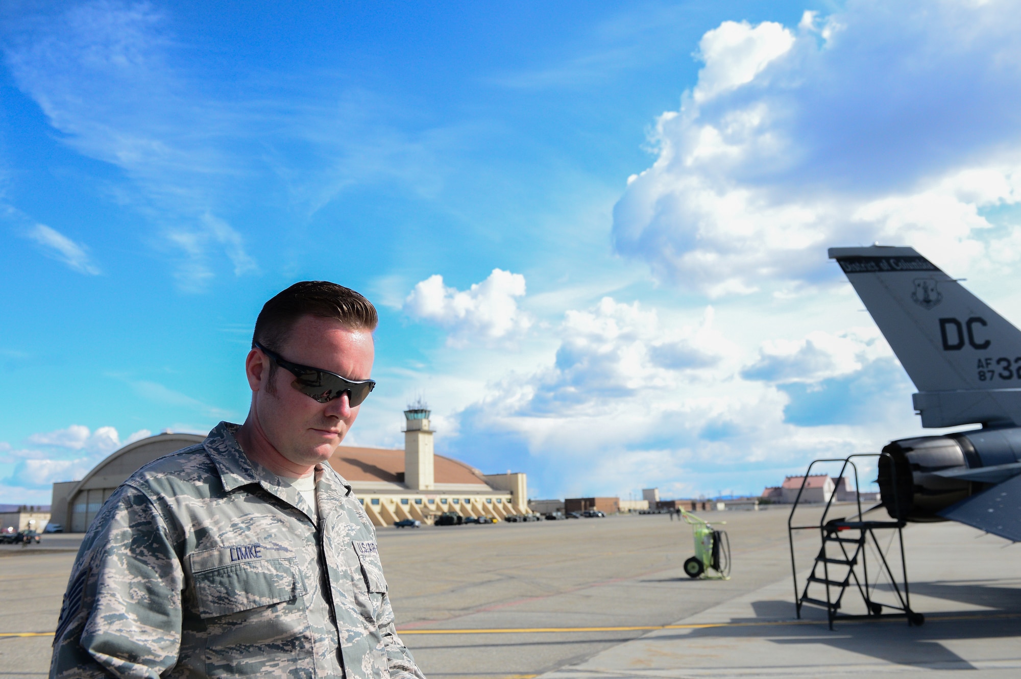 U.S. Air Force Tech. Sgt. Andrew Limke, a 113th Wing, District of Columbia Air National Guard crew chief, looks through technical orders for an F-16 Fighting Falcon at Eielson Air Force Base, Alaska, April 27, 2015. The unit is preparing to participate in RED FLAG-Alaska 15-2 large-force employment training. (U.S. Air Force photo by Staff Sgt. Shawn Nickel/Released)