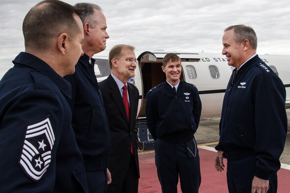Air Force Chief of Staff Gen. Mark A. Welsh III is welcomed to Hanscom Air Force Base, Mass., by (right to left) Maj. Gen. Craig S. Olson, C3I and Network Directorate program executive officer, Steve Wert, Battle Management Directorate PEO, Col. Michael A. Vogel, 66th Air Base Group commander, and Hanscom Command Chief Master Sgt. Craig A. Poling on the base flightline April 30. The general is speaking with military fellows, senior executive fellows and members of faculty at Harvard University. (U.S. Air Force Photo by Walter Santos)