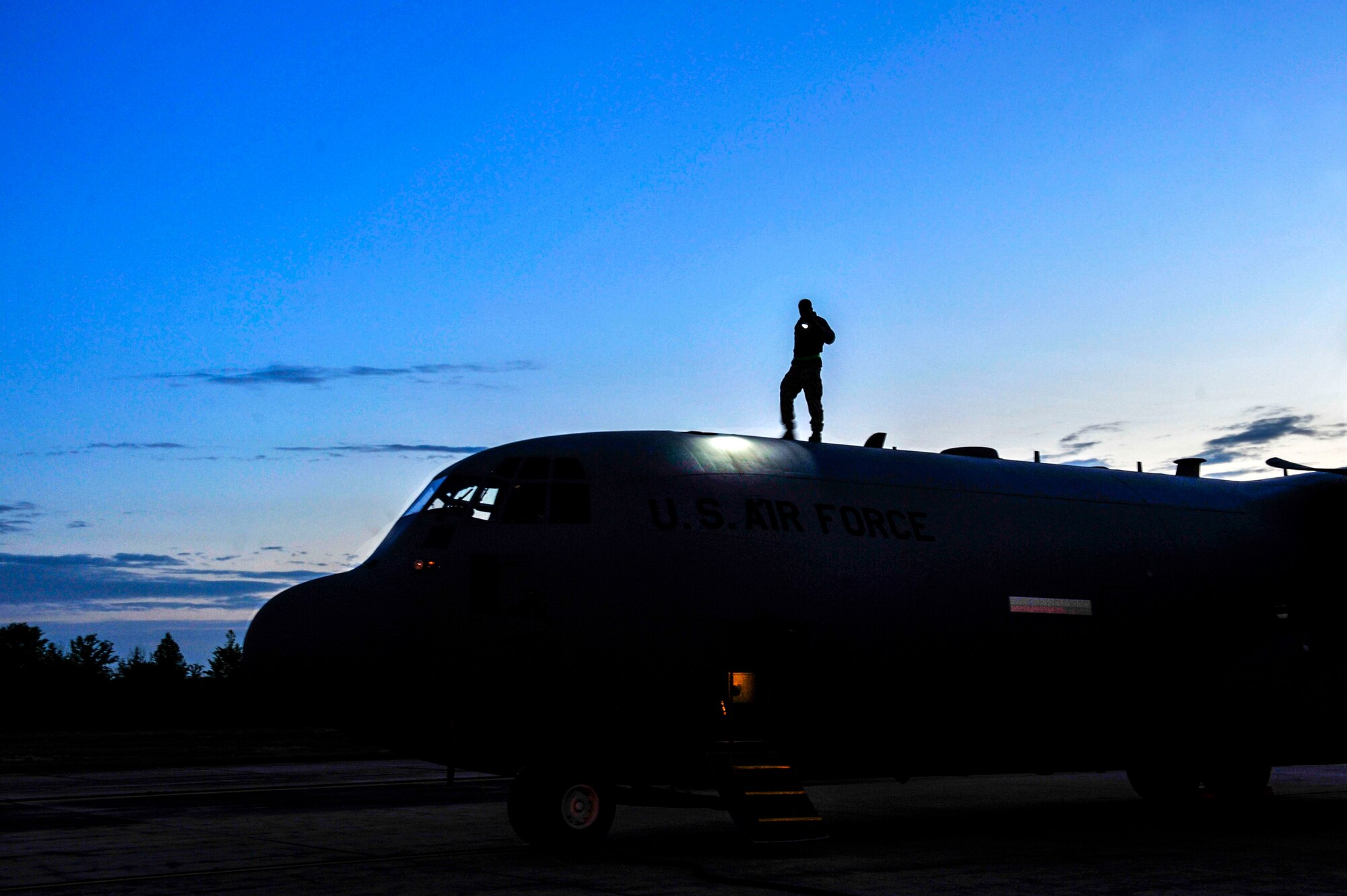 Airman 1st Class Tyler Otis, a 19th Aircraft Maintenance Squadron crew chief, looks for damage on a C-130 April 22, 2015, at Little Rock Air Force Base, Ark. During flight, birds can hit the aircraft and cause serious damage.(U.S. Air Force photo by Senior Airman Stephanie Serrano)