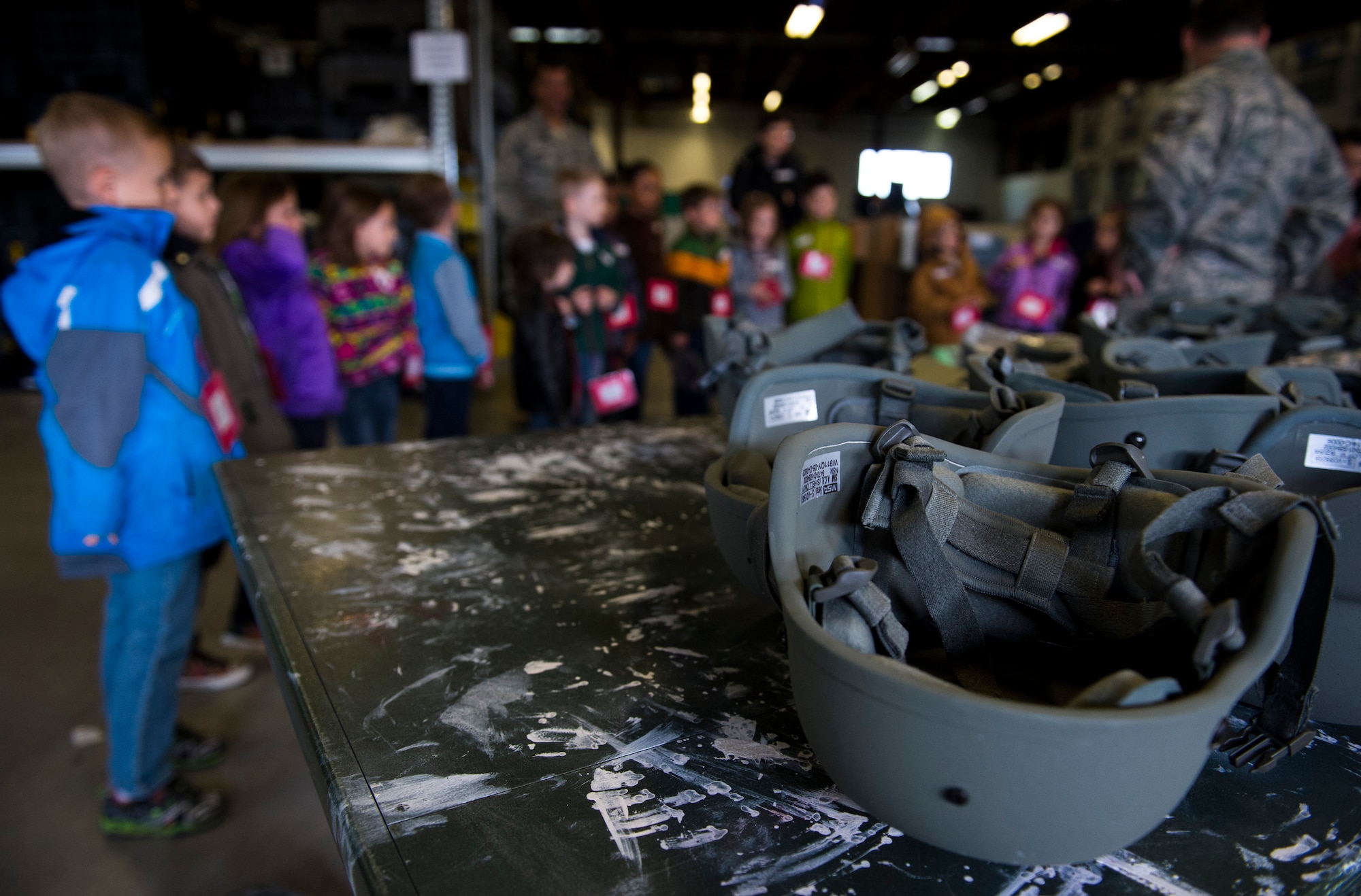 Helmets rest on a table during Kids’ Deployment Day at Spangdahlem Air Base, Germany, April 29, 2015. The Kids’ Deployment Day consisted of nearly 600 students ranging from kindergarden to sixth grade learning the process their parents might have to go through before a deployment. (U.S. Air Force photo by Airman 1st Class Luke Kitterman/Released)  
